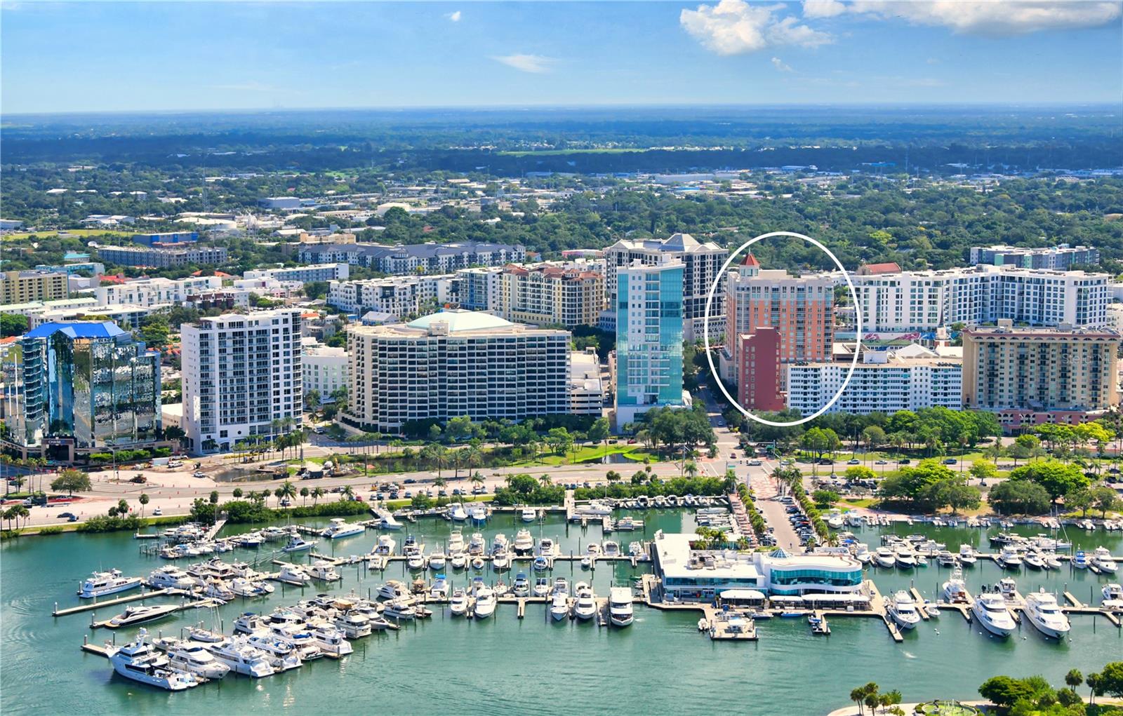 Welcome to the epitome of downtown Sarasota living—where sophistication meets convenience in this bright and airy residence perfectly positioned in the heart of the city. With restaurants, coffee shops, galleries, and the marina just steps away, this home offers an ideal walkable lifestyle. Located on the sought-after bayfront-facing side of the building, the residence overlooks the vibrant boutiques and cafés of Palm Avenue while inviting in abundant natural light through expansive windows and sliding glass doors. Step onto your private balcony each morning to enjoy coffee as the city awakens or unwind in the evening while taking in the lively downtown atmosphere. Inside, soaring ceilings and an open floor plan create a spacious, airy feel. The living area features elegant tile floors and a warm, modern palette, flowing seamlessly into the European-style kitchen. Designed for both form and function, the kitchen offers sleek cabinetry, generous counter space, stainless steel appliances, and a serving bar that connects to the living space for easy entertaining. The oversized bedroom is a tranquil retreat with a large walk-in closet and spa-like en suite bath featuring a soaking tub, frameless glass shower, and dual vanities. A well-appointed powder room, ample storage throughout, and the building-wide water softener filtration system add to everyday comfort. This pet-friendly residence includes one dedicated parking space and a climate-controlled storage unit. Owners enjoy exclusive access to an impressive suite of amenities: 24-hour concierge service and fitness center with steam rooms, plus 72-foot heated lap pool, spa, media and social rooms, library, and a guest suite for visiting friends and family (available on a first-come basis). Just outside your door, Sarasota’s cultural and culinary scene awaits. Stroll to the farmers market, attend performances at the Sarasota Opera House or Van Wezel Performing Arts Hall, or spend the day exploring nearby Lido Key Beach and St. Armands Circle. Whether for a seasonal getaway or year-round home, this property offers a rare combination of modern luxury, vibrant city living, and resort-style convenience.