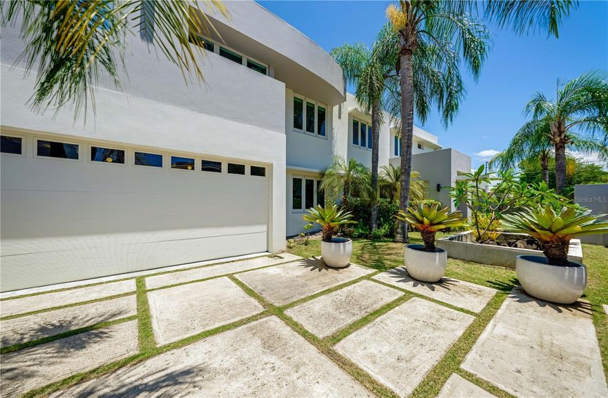 ***SOLD*** A rare opportunity in one of San Juan’s most exclusive coastal enclaves. Situated just one block from the ocean on a gated street in Punta Las Marias, this elegant two-story residence offers a refined blend of luxury, privacy, and functionality. With five bedrooms and five full bathrooms, every space in this home with approx. 3,935 air conditioned interior Sq. Ft. has been thoughtfully curated to elevate daily living. Featuring soaring double-height ceilings, floor to ceiling windows in the dining room and exquisite marble floors throughout, creating an atmosphere of spaciousness and sophistication. The kitchen, fully renovated in 2021, showcases a clean, modern aesthetic ideal for entertaining. Tailored for a lifestyle of balance and inspiration, the home includes a private gym and an artist studio—perfect for wellness routines or creative pursuits. The enviable primary bedroom is ensuite and is accented by a generously-sized walk-in closet, in addition to exclusive access to an inviting terrace with approx. 103 Sq. Ft. overlooking the manicured landscaping. Outdoors, a lush oasis awaits, with a swimming pool, expansive covered patio with approx. 742 Sq. Ft., and a spacious outdoor kitchen designed for relaxed alfresco living in the island breeze. A two-car garage with approx. 387 Sq. Ft., full-power generator, and water cistern ensure uninterrupted comfort, adding practicality to this exceptional property. Located in one of San Juan’s most desirable beachside neighborhoods, this home offers the perfect combination of exclusivity, elegance, and proximity to the ocean.