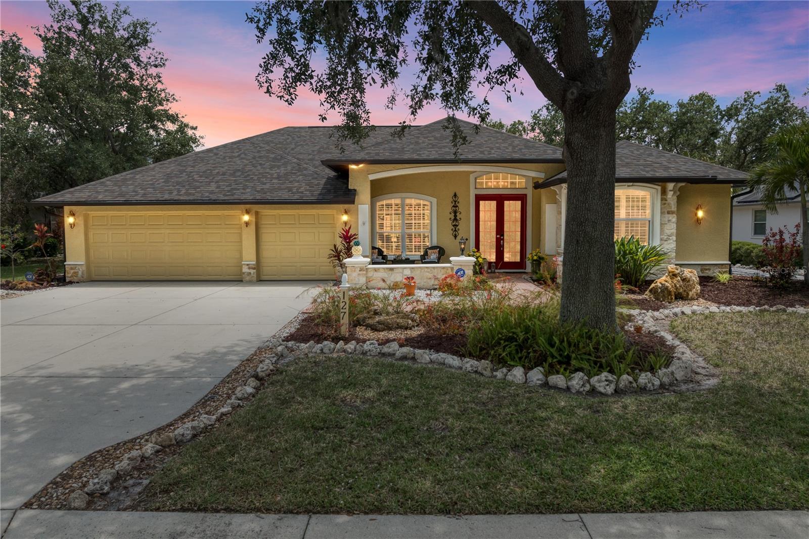 One or more photo(s) has been virtually staged. Must See, Move-In Ready Spectacular Lake & Garden View Florida Oasis! Spacious 4 Bd + Flex Room, 3 Bath, 3 Car Garage, SFH sits on Fully Irrigated .51 Acre Lot, Nestled in Tranquil Park Like Setting of Highly Desirable Country Creek w/ A-Rated Lakewood Ranch Schools. Location, Luxury & Condition Set this Gem Apart! Completely Upgraded to Highest Luxury Standards (2015-2025), Tastefully Updated w/ Attention to Details & Meticulously Maintained w/ Pride of Ownership. Striking Curb Appeal w/ Distinctive Taste Inspired by Lavish Mediterranean Villas, Limestone Accent Walls, Architectural Moldings, French Chateau’ Lightings, Extra Large Driveway & Professionally Designed Landscaping. New Shingle Roof (2021), 6” Gutters/Downspouts w/ Leaf Guard & Buried Pop-Up Drains provide Peace-of-Mind & Ease of Maintenance. Expansive Covered Front Porch, Rear Lanai & Waterfront Backyard host Hummingbirds, Blue Jays, Red Robbins, Hawks, Woodpeckers & Butterflies in Year-Round Blooming Florida-Friendly Low-Maintenance Butterfly & Rock Gardens w/ Tropical Palms, Bird of Paradise, Hibiscus, Desert Rose, Pineapples & Succulents. Brick Paved Walkway leads to Grand Double French Door Entry secured w/ Lockly Elite Video Smart Lock w/ Camera, Wi-Fi, PIN Genie® Keypad, No Monthly Fee Remote Control App & 2 Way Audio Doorbell. Impressive Soaring High 12’ Ceiling Foyer & 14’ Cathedral Ceilings in Formal Living & Dining Rooms where Extraordinary Expansive Lake & Garden View Takes Your Breath Away! New Nucore 8mm High Performance Luxury Vinyl Flooring in Formal Living & Dining, All Secondary Bedrooms & Flex Room (2025) is Water/Pet Proof, Extreme Scratch/Dent Resistant & Easy-To-Clean. Designer High-End Gourmet Kitchen is Chef’s Delight w/ Double-Stacked 65” Upper Cabinets w/ Glass Doors, Soft Close Solid Wood Cabinetry, Top of the Line Kitchen Aid Appliances, Large Island, Extra-Large Breakfast Bar, Italian Hardware, Walk-In Pantry, Inside/Under Cabinet LED Lighting, Hidden Electric Outlets, Glass/Marble Backsplash & Gorgeous Floor to Ceiling Feature Wall. Unobstructed View of FL Great Room, Pool/Spa, Garden & Lake from Kitchen & Breakfast Nook. 4 sets of Sliding Glass Doors spell Ultimate Indoor-Outdoor FL Living Experience. Split Floor Plan offers Privacy & Functionality. Master Bedroom Suite in front of home w/ Coffered Ceiling, 2 Large His & Her Walk-In Closets, View of Tropical Haven & a Luxury Spa Bathroom w/ Dual Sinks, Garden Tub, Separate Vanity & Spacious Walk-In Roman Shower w/ Fresco Rain/Body Shower System, 5.5’ Carrara Marble Bench, Glass & Marble Mosaic Tiles & Frameless Glass Enclosure is Fit for Royalty. Largest Secondary Bedroom serves as 2nd Master in rear of the property w/ Dedicated Bathroom opening up to Pool & Backyard. Huge Flex Room w/ Sliding Glass Door leads to Great Outdoors w/ Full View of Lakeside Backyard Oasis. This wing can serve as a Mother-In-Law Suite. 3rd wing boasts 2 Bedrooms & 3rd Luxury Bathroom w/ Tub & Shower. Brick Paved Pool Deck, Caribbean Blue Pebble Tech Salt-Water Heated Pool w/ Iridescent Glass Tiles, Multi-Color LED Pool Lighting, HotSpring Spa, Night Blooming Jasmine & Expansive 180 Degree Lake/Garden View make an Exceptional Lanai. 109’ Paved Pathway from Pool Cage to Impressive Serene Lakeside Flagstone Area w/ Spanish-Moss-Covered Mature Florida Oak Trees swaying in Subtle Gulf Breeze Reminiscent of Elegant Old Florida. Home Warranty until Dec 30, 2026. Seller is Listing Agent & Licensed Florida Realtor.