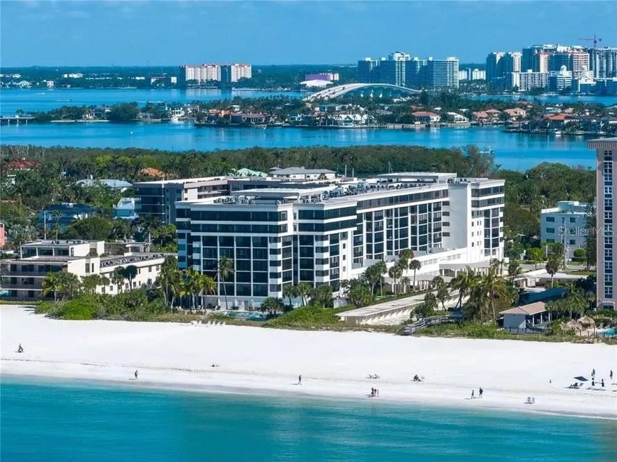 Price Improvement!! Rare, fully renovated Gulf-front living with an oversized protected balcony. Experience refined coastal living at Lido Surf and Sands, where this completely reimagined Gulf-front residence delivers space, quality, and year-round indoor/outdoor enjoyment. Renovated down to the studs in 2020-2021, the home offers 1763 SF of interior living PLUS an extraordinary 1300+ square foot protected balcony that truly functions as an outdoor living room-ideal for entertaining or simply relaxing with the Gulf breeze in every season. Hurricane rated stacking sliding glass doors create a seamless flow between inside and out, flooding the open living areas with natural light and panoramic beach views. The chef's kitchen is both striking and functional, featuring custom cabinetry, an expansive center island and premium Thermador appliances.   Every finish was selected with intention-clean design, timeless materials, and smart functionality.   The split-bedroom layout provides privacy and flexibility: a spacious primary suite with custom walk-in closet, spa-inspired bath featuring dual vanities and an oversized walk-in shower. A second ensuite bedroom with a built-in Murphy bed and custom storage--perfect for guests or a sophisticated home office. A third bedroom with floor-to-ceiling windows, ideal for additional guest or workspace.   A third full bath is conveniently positioned for visitors. Additional highlights include a full in-unit laundry room, an assigned, secure garage parking space on the second level, private storage, and on-site management.
Residents of Lido Surf and Sands enjoy a beachfront pool and spa, fitness center and direct access to the white sands of Lido Beach. Ideally positioned between the Ritz Carlton, Sarasota and the newly introduced Rosewood Residences of Lido Key, this stretch of shoreline remains notably quiet, with no public parking at this complex.  
Stroll to St. Armands Circle for dining and shopping, kayak through mangrove tunnels at Ted Sperling Park, or reach downtown Sarasota in under ten minutes.
This is Gulf front living without compromise---spacious, thoughtfully redesigned, and exceptionally livable both inside and out.