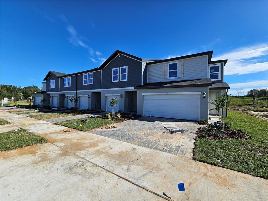 One or more photo(s) has been virtually staged. Under Construction. Brand-New Townhome in Reserve at Hammock Oaks – Lady Lake, FL
This is a 2-story townhome with 3 bedrooms, 2.5 bathrooms, and a 1-car garage. It’s move-in ready and perfect for first-time buyers, snowbirds, or investors. What makes it special? It’s stylish, energy-efficient, and located in a growing neighborhood just minutes from The Villages.
Let’s Walk Through the Home
Inside, you’ll find 1,485 square feet of open living space. The kitchen has white cabinets with crown molding, quartz countertops, and stainless steel appliances—including a refrigerator, range, microwave, and dishwasher. It also comes with a washer, dryer, and blinds, so you don’t need to buy anything extra.
The laminate floors in the main areas are easy to clean, while the bedrooms have soft carpet for comfort. The bathrooms and laundry room feature large-format tile. The kitchen island has bar seating and opens to the Great Room, making it easy to cook and chat with guests. You can even see the backyard from the kitchen sink, which is great for entertaining.
Built for Comfort and Savings
This home is Energy Star Certified, which means it’s built to save energy and money. It has spray foam insulation and a fresh air intake system to help reduce allergens and keep the air clean. It’s quieter, healthier, and more efficient.
Community Fun
Living in Reserve at Hammock Oaks means you get access to:
•  A resort-style pool and splash pad
•  A playground and dog park
•  Pickleball courts and walking trails
•  Lots of green space to enjoy the outdoors
Great Location
You’re just minutes from The Villages, a popular spot for shopping, dining, golf, and entertainment. You’re also close to Lake Griffin State Park, Spanish Springs Town Square, and Lake Sumter Landing. Nearby, you’ll find restaurants, boutiques, medical centers, and grocery stores. There are also golf courses, nature trails, and community events happening all year.
Buyer Summary
•  Location: Reserve at Hammock Oaks, Lady Lake, FL—near The Villages
•  Benefits: Brand-new, low-maintenance, energy-efficient, and move-in ready
•  Interior Highlights: 3 beds, 2.5 baths, quartz countertops, stainless appliances, open layout, stylish finishes
•  Exterior Highlights: 1-car garage, backyard view from kitchen, resort-style amenities
•  Lifestyle Fit: Great for first-time buyers, snowbirds, and investors
Ready Before Year-End
Don’t wait—schedule your tour today and make this home yours before the year ends!