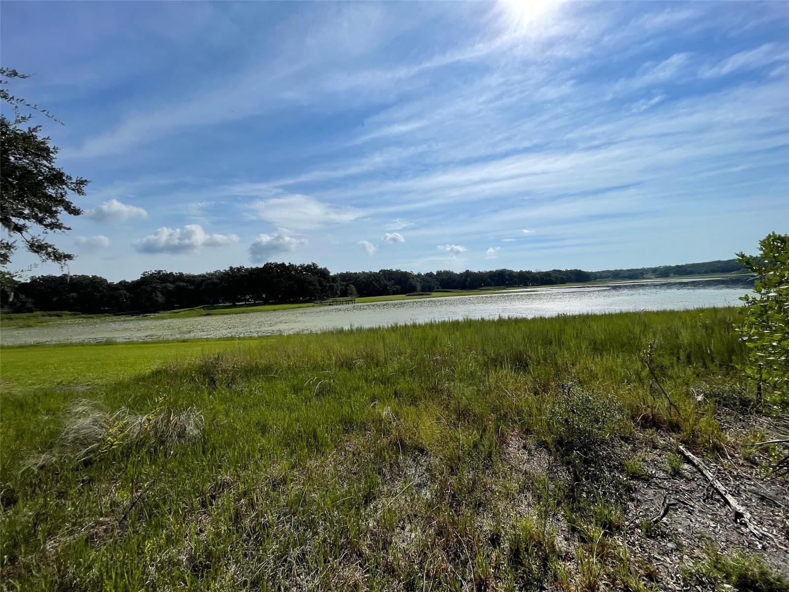 AWESOME LAKE FRONT PROPERTY ON A BIT MORE THAN 1/2 ACRE (0.52 Acres) LOCATED ON A DEAD END STREET IN RAINBOW LAKES ESTATES WITH NO HOA OR TIME LIMIT TO BUILD (No Mobile Homes). PEACEFUL AND SERENE THIS HOMESITE IS NICELY TREED AND WOODED. WHAT A GREAT LOCATION TO BUILD YOUR DREAM HOME, VACATION HOME OR AIRBNB ON THE LAKE. LOCATED ON BONABLE LAKE THIS LOT IS PERFECT FOR BOATING, FISHING OR KAYAKING RIGHT AT YOUR DOORSTEP! JUST IMAGINE ENJOYING THE BEAUTIFUL VIEW AND RELAXING LAKE FRONT TAKING IN ALL THAT NATURE HAS TO OFFER AND OUR GREAT FLORIDA WEATHER. RAINBOW LAKES OFFERS MANY FEATURES INCLUDING 2 PLAYGROUNDS AND PARK, EXERCISE ROOM, COMMUNITY CENTER, AND TENNIS, BASKETBALLLL AND RACQUET BALL COURT. CONVENIENT TO DOWNTOWN DUNNELLON GREAT FOR QUAINT ANTIQUE SHOPS, RESTAURANTS AND SHOPPING, OCALA, GAINESVILLE, CRYSTAL RIVER, GULF OF MEXICO, WORLD EQUESTRIAN CENTER FOR WORLD CLASS EQUESTRIAN SPORT AND THE CRYSTAL-CLEAR WATERS OF RAINBOW SPRINGS STATE PARK WHERE YOU CAN ENJOY SWIMMING, SNORKELING, TUBING AND PICNICING. ***THERE IS ALSO AN ADJACENT LOT NEXT DOOR FOR SALE AT AN ADDITIONAL COST. THE 2 LOTS TOGETHER WOULD GIVE YOU 1.04 ACRES.