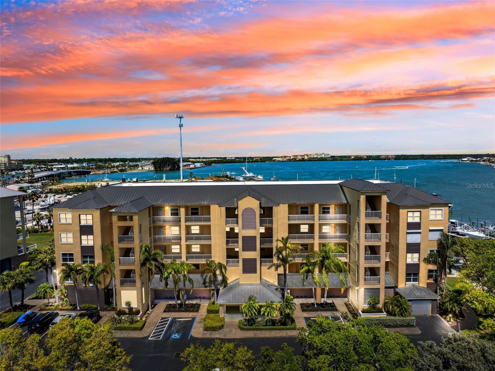 Welcome to the epitome of luxurious waterfront living at Snug Harbour, where the conveniences of condo life meet the comforts of home. This exceptional top-floor condominium in the exclusive Snug Harbour community on Madeira Beach is a rare find, offering a lifestyle replete with amenities.This highly sought after top floor corner unit features a spacious and bright open floor plan with high ceilings. The beautiful open kitchen, featuring solid wood cabinetry and granite countertops, seamlessly overlooks the great room and waterfront, perfect for both entertaining and relaxing as well as a desirable split bedroom design, a large interior laundry room, and an expansive waterfront primary suite that includes an en-suite bath and walk-in closets.
Elegant finishes abound, with Brazilian pecan engineered flooring throughout, complemented by crown molding. The expansive covered balcony, accessed through PGT hurricane sliders, offers an ideal spot for leisure or hosting. Notable recent updates include a new HVAC system in 2021 and a new hot water tank in 2023, a water softener and central vacuum. The condo also comes with an oversized one-car garage and a deeded boat slip with a 10,000 lb lift, making it perfect for boating enthusiasts.
Located in a breathtaking waterfront setting, the pet friendly community of Snug Harbour presents resort-style amenities such as a pool and spa, a vibrant community room, a handy community ice machine, lush green spaces, and ample guest parking. Enjoy the prime location with easy access to shopping, dining, the iconic Johns Pass Boardwalk, and some of Florida's finest beaches.
Constructed in 2003, this immaculate condo is perfectly suited as either a primary residence or a second home. Here at Snug Harbour, there’s no need to compromise—experience the best of both worlds.