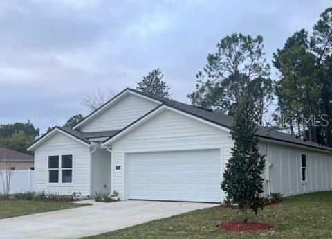 Photo of 7 Ulawood Place, Palm Coast, FL 32164 (MLS # FC314528)