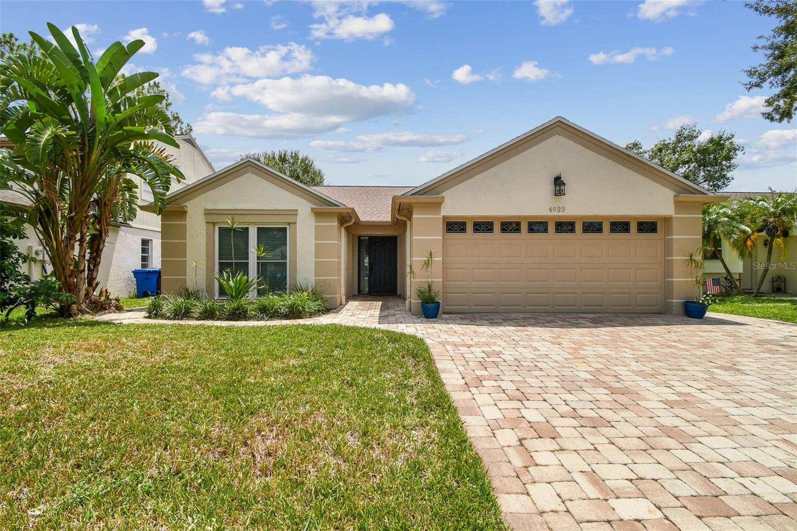 Welcome to this beautifully updated 3-Bedroom, 2-bath home in Carrollwood Village. The inviting living room features a cozy fireplace, while the renovated kitchen offers warm white cabinetry, granite countertops, and stainless steel appliances.The open layout flows seamlessly into the dining area, creating the perfect space for entertaining. The split floorplan provides privacy with the primary suite on one side and the secondary bedrooms on the other. Step outside to your private screened patio, pool and spa surrounded by tropical landscaping-ideal for entertaining. Recent upgrades include a New Roof (2023), New Fence (2022), Flooring (2021), AC and Ductwork (2021), Huricane covers (2021), Irrigation system and Brick Pavers (2019), Pool Heater (2023), Washing Machine (2024). Convenietly located near shopping, dining and the parks and amenities of Carrollwood Village and West Village Park. Move in ready!