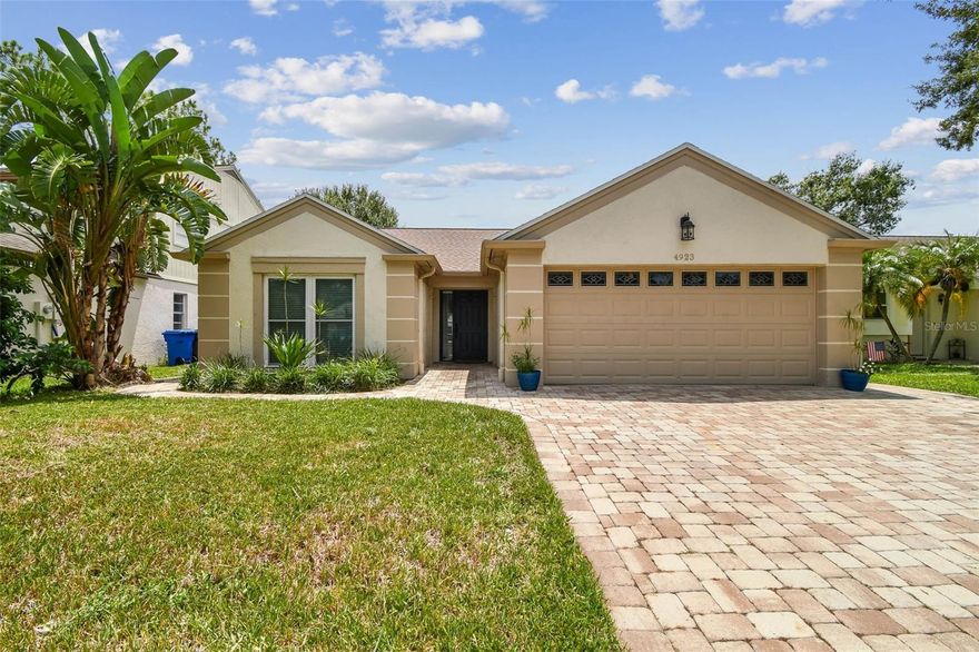 MOVE IN READY!! Welcome to this beautifully updated 3-Bedroom, 2-bath POOL and Spa home in Carrollwood Village. The inviting living room features a cozy fireplace, while the renovated kitchen offers warm white cabinetry, granite countertops, and stainless steel appliances.The open layout flows seamlessly into the dining area, creating the perfect space for entertaining. The split floorplan provides privacy with the primary suite on one side and the secondary bedrooms on the other. Step outside to your private screened patio, pool and spa surrounded by tropical landscaping-ideal for entertaining. Recent upgrades include a New Roof (2023), New Fence (2022), Flooring (2021), AC and Ductwork (2021), Huricane covers (2021), Irrigation system and Brick Pavers (2019), Pool Heater (2023), Washing Machine (2024). Convenietly located near shopping, dining and the parks and amenities of Carrollwood Village and West Village Park. 6 Miles to USF,  Move in ready!
