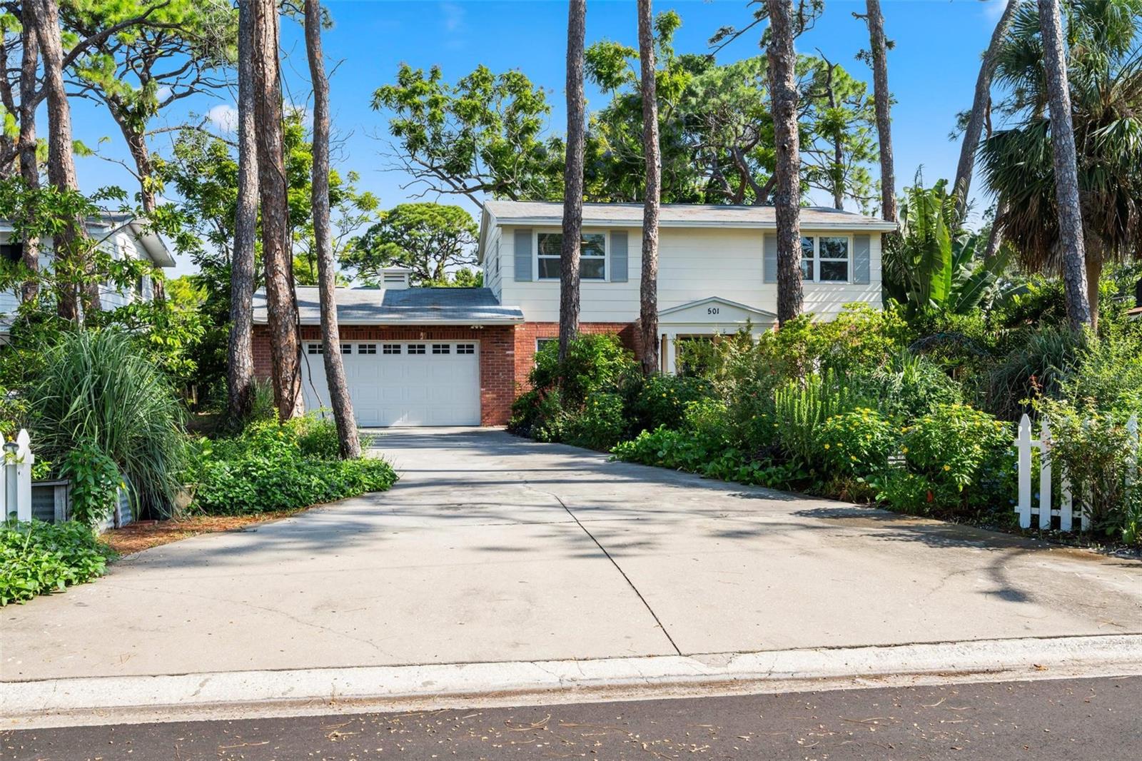 Welcome to your dream retreat surrounded by nature! This unique property sits on an expansive 19,384 sq.ft. lot filled with tropical fruit trees, lush plants, and vibrant flowers—perfect for those who crave space, privacy, and a deep connection with the outdoors. With no backyard neighbors, the property overlooks Forrest Bluff Park, while Bay Vista Park with its creek, walking areas, and playground is just a short distance away.
Tucked in a peaceful, low-traffic South St. Pete neighborhood favored by cyclists, this home offers a serene lifestyle while keeping you close to beaches, parks, schools, and city amenities.
Inside, you’ll find bamboo and wood flooring, a new HVAC, and a roof replaced in 2016. The updated kitchen shines with beautiful countertops, stylish cabinetry, and stainless-steel appliances—ideal for culinary enthusiasts and entertaining. A spacious family room features soaring ceilings with exposed wooden beams, while the living and dining rooms are bathed in natural light and calming views of the greenery outside.
With 4 bedrooms, two and a half bathrooms, and a primary suite, comfort abounds. A versatile den can easily serve as a fifth bedroom, office, or hobby that suit your lifestyle.
Outdoors, the oversized yard offers everything a nature lover could dream of: a greenhouse, a chicken coop, dedicated space for a beekeeper, and raised boxes for vegetables and fruits. Whether you’re sipping your morning coffee in the garden, gathering fresh produce, or hosting a backyard barbecue, this property provides endless opportunities to live in harmony with nature. A well and full irrigation system make upkeep a breeze.
Adding even more value, the backyard already has a slab with drains and plumbing in place—ready for a second dwelling or guest house.
This home is a rare opportunity for buyers who want space, privacy, and a lifestyle immersed in nature. Don’t miss it—schedule your private tour today!