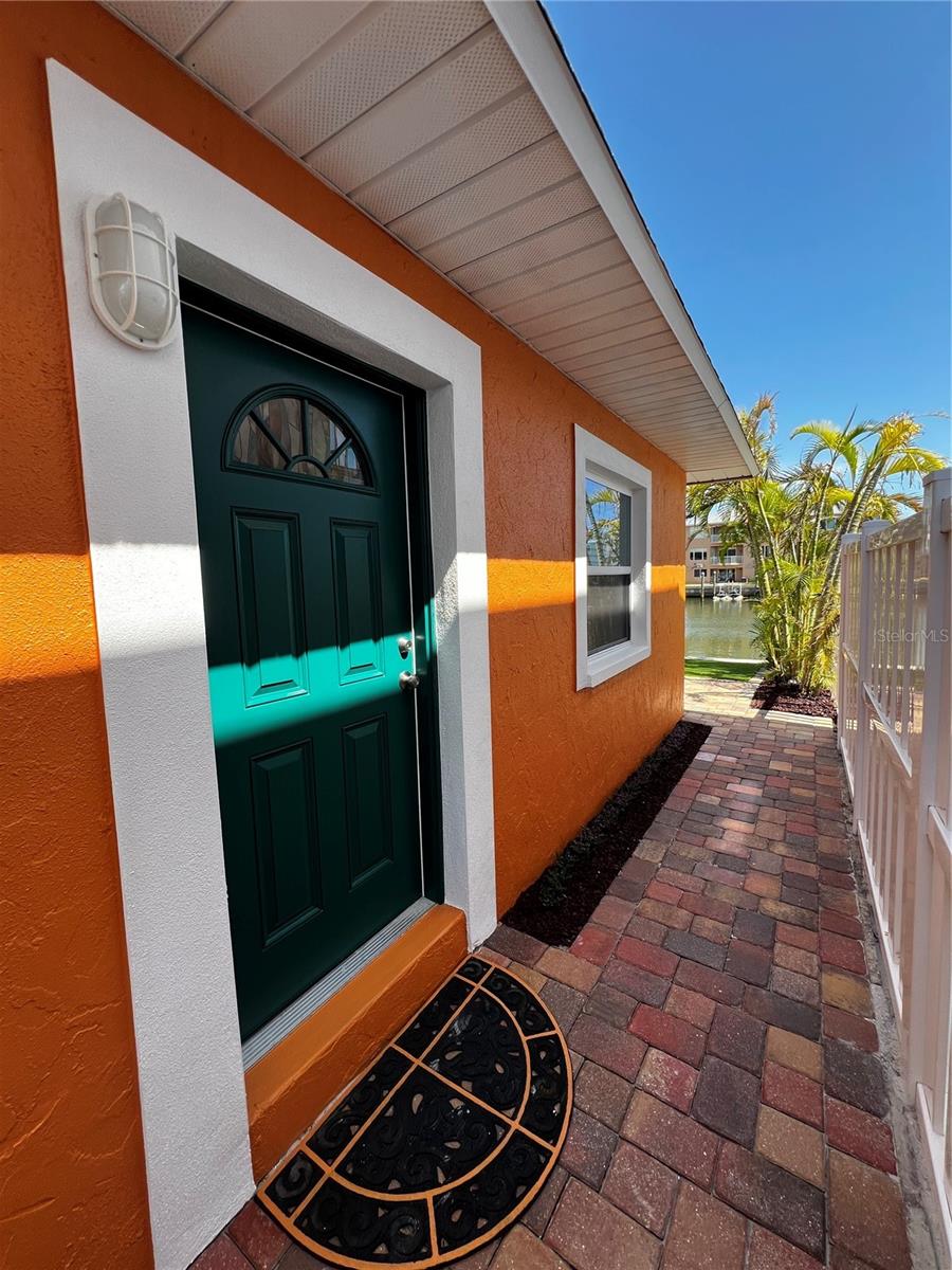 Welcome to 137 175th Dr E, Unit B – a fully remodeled 2 bedroom, 2 bathroom WATERFRONT unit located on the right side of a charming duplex in the heart of Redington Shores. Offering 1,100 sqft of heated living space, this coastal retreat features an updated kitchen with soft-close cabinetry, quartz countertops, and brand new stainless steel appliances. The open living area includes sliding glass doors that lead to a private, fenced backyard designed for relaxation and entertaining, with lush Areca palms lining the fence for privacy, low-maintenance turf, and stylish pavers. Enjoy your morning coffee with the dolphins and unwind at sunset as manatees drift by—this is true Florida living! Just steps from the beach, dining, and shopping, the location is unbeatable. The guest bedroom is spacious with a built-in closet, while the large primary suite includes a walk-in closet and ensuite bath with a stand-up shower. Additional features include a laundry room with stackable washer/dryer hookups, two storage closets, two parking spaces out front, and pet-friendly options at the landlord’s discretion. Have a boat? There’s a wet slip available to rent on the property for an additional monthly fee—bring your water toys and live the true Florida lifestyle! Tenant application, first, last, and security deposit required prior to move-in.