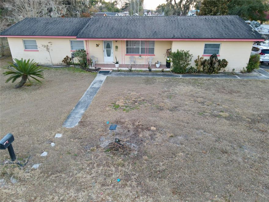 WELCOME TO YOUR PRIVATE SLICE OF SPACE & FREEDOM! This spacious 3BR/2BA home offers 1,854 SqFt and sits on a generous 0.34-acre lot at the end of a quiet street for added privacy. Yet is just minutes from the interstate for an easy commute. Enjoy abundant parking with a 2-car garage, 1-car carport, and extended driveway — perfect for guests, toys, or work vehicles. Inside, features durable ceramic tile and classic terrazzo flooring throughout — NO CARPET ANYWHERE!! A flexible family/bonus room creates the ideal space for entertaining, a game room, or home office. Step outside to a fully chain-link fenced yard with plenty of room to relax or play. PLUS, NO HOA means freedom to truly make it your own. SPACE, PRIVACY, & CONVENIENCE — THIS ONE HAS IT ALL!!!