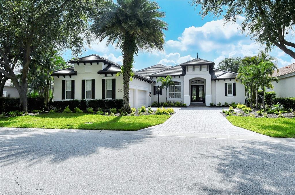 ACCEPTING BACK UP OFFERS! This MOVE-IN READY, 4 bed, 4 bath DREAM home located behind the gates of the Lakewood Ranch Country Club and is available with furniture! This FRESH interior offers a brand new air conditioner and four new luxurious bathrooms, updated kitchen, with New Fulgor Milano stainless steel appliances, gorgeous new engineered hardwood wide planked flooring and new lighting that will take your breath away. Step inside the double doors to this designer masterpiece and enjoy the magnificent living room and exquisite dining room with custom wine wall, exquisite chandelier and butlers pantry. Marvel at the kitchen quarts countertoprs, marble backsplash, and spectacular pendant lighting. The eat in kitchen is a great space for casual dining overlooking the pool and spa. The family room is spacious and inviting with custom wall feature and built-in television, electric fireplace, and floating shelves. The study is located in the rear of the home offering incredible views of the golf course, hole #3 on Kings Dunes course! The second floor has a generous size bonus room, new remodeled full bathroom and fourth bedroom! The primary suite is located behind a set of double doors and offers two closets with custom built in cabinetry. The owners' bathroom is a masterpiece with large walk-in shower, two shower heads and a rain shower. Relax and unwind soaking in the sleek free standing tub! Dual sinks, large porcelain tile and fabulous new lighting make this a bathroom a must see! This maintenance free community maintains your lawn and provides cable and basic internet, so you can focus on living the amazing Florida lifestyle! The outdoor lanai is perfect for entertaining with gorgeous natural gas grill and pool and spa! Lakewood Ranch Country Club has three golf courses, two clubhouses, 20 lighted tennis courts, pickleball courts, athletic center, two swimming pools with lap lanes and more! Top rated schools, nationally ranked beaches and local airports are close by! This home will not last long!