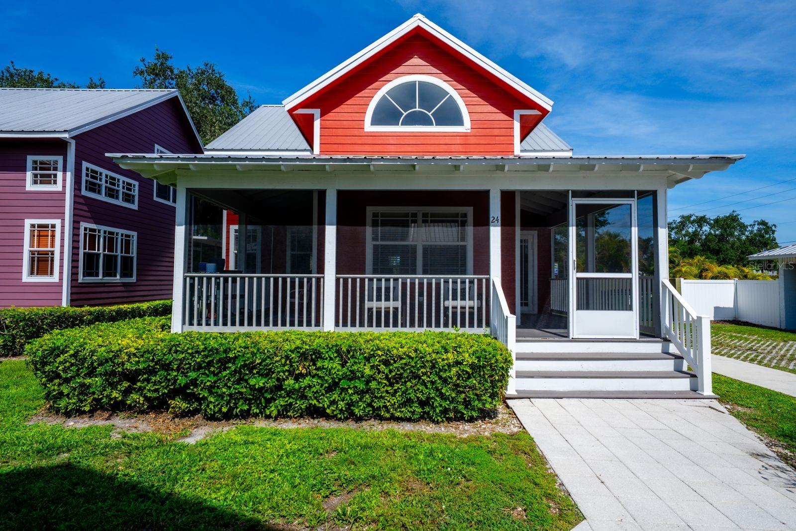 Fall in love with this Key West style 1 bedroom + Den and 2 bath cottage featuring 1,090 sq. ft. of bright, open living with vaulted ceilings, a pantry kitchen, inside laundry, and a main-level primary suite. Relax outdoors on the wraparound porch, screened lanai, or deck, and take advantage of the navigable canal with direct Gulf access through a maintained lock, ensuring smooth boating, steady water levels, and open passage to Lake Okeechobee. Built in 2007 with durable fiber cement siding and a metal roof, this home is nestled in a well-kept community with included services and amenities, making it the perfect year round retreat or seasonal getaway