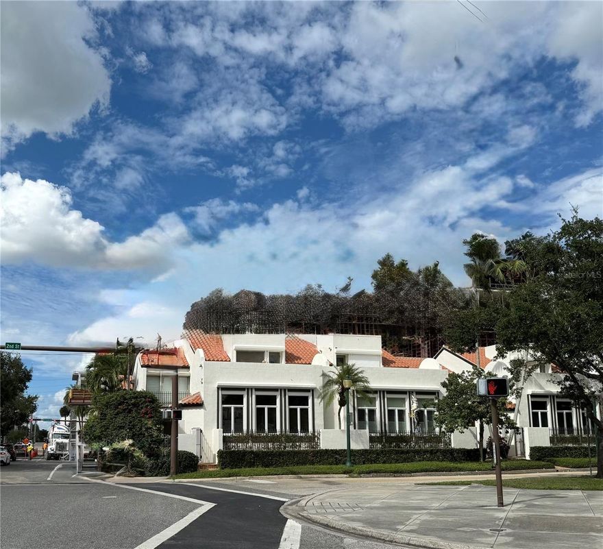 Downtown Sarasota Villa with Rooftop Terrace! Exterior renovations are now nearly complete! 

A rare offering in the heart of downtown Sarasota, this private villa in the coveted Library Mews community seamlessly blends timeless charm with modern convenience—just steps from the city’s finest dining, shopping, arts, and culture.

Tucked behind a gated brick courtyard, this two-story residence offers the feel of a hidden retreat while placing you moments from it all. Step inside to soaring ceilings, rich wood floors, and sun-filled living spaces designed for both comfort and connection. The beautifully updated kitchen features crisp white cabinetry, quartz countertops, stainless steel appliances, and an island with bar seating—perfect for casual meals or entertaining.

The main level also includes a spacious living room, formal dining area, a flexible bonus room ideal for a home office or den, and a convenient powder bath. Every space is thoughtfully designed to maximize light, function, and flow.

Upstairs, two en-suite bedrooms offer peaceful separation and privacy. The primary suite boasts vaulted ceilings, generous closet space, and tranquil treetop views, while the second suite is equally well-appointed—perfect for guests or additional family.

Crowning the villa is an expansive private rooftop terrace, offering partial bay views and sweeping downtown vistas—a true rarity in this location. Whether enjoying a quiet sunrise or hosting friends under the stars, this outdoor space elevates everyday living.

Additional highlights include a private one-car garage with gated access, interior laundry, and low-maintenance living with a boutique community feel. From the Sarasota Opera House and Selby Library to Whole Foods, Marina Jack, and the Bayfront—everything you love about downtown Sarasota is right outside your door.

This is more than a villa—it’s a lifestyle. Don’t miss your opportunity - book your showing today!