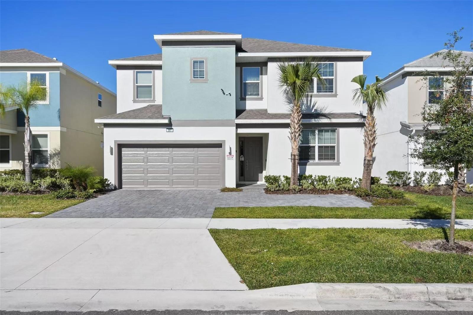 Lakeview! Exquisite 12-Bedroom Luxury Vacation Home in Prime Kissimmee Location! Welcome to professionaly staged fully furnished 12-bedroom, 11.5-bathroom luxury vacation retreat that defines modern resort-style living. Located in one of Central Florida’s most desirable short-term rental communities, this entertainer’s dream is just minutes from Walt Disney World, world-class dining, and shopping. Step inside to a professionally designed interior featuring high-end finishes, custom furnishings, and themed bedrooms that enchant guests of all ages. The expansive open-concept layout includes a gourmet kitchen with stainless steel appliances, oversized island seating, and a spacious living and dining area perfect for large families or groups. Entertainment takes center stage with a vibrant LED-highlighted game room, complete with arcade machines, game consoles, and sleek décor that lights up the fun. Guests will also love the private theater room, designed with plush seating and a big-screen experience for movie nights in. Out back, unwind in your private screened-in pool and spa, surrounded by peaceful wooded views with no rear neighbors—an ideal setting for total relaxation. The covered lanai and outdoor dining space provide the perfect area for soaking up the Florida sun. A rare bonus feature is the extra-long driveway, offering ample parking for large groups or multiple families, making this home as functional as it is beautiful. Whether you're looking for a high-performing short-term rental investment or a luxury retreat for personal use, this property checks every box. Key Features: 12 Bedrooms | 11.5 Bathrooms Fully Furnished & Professionally Designed LED-Lit Game Room & Private Theater Room Private Pool & Spa with Wooded Views Extended Driveway with Additional Parking for Large Groups Turnkey Short-Term Rental Ready Minutes to Disney Parks, Dining & Attractions