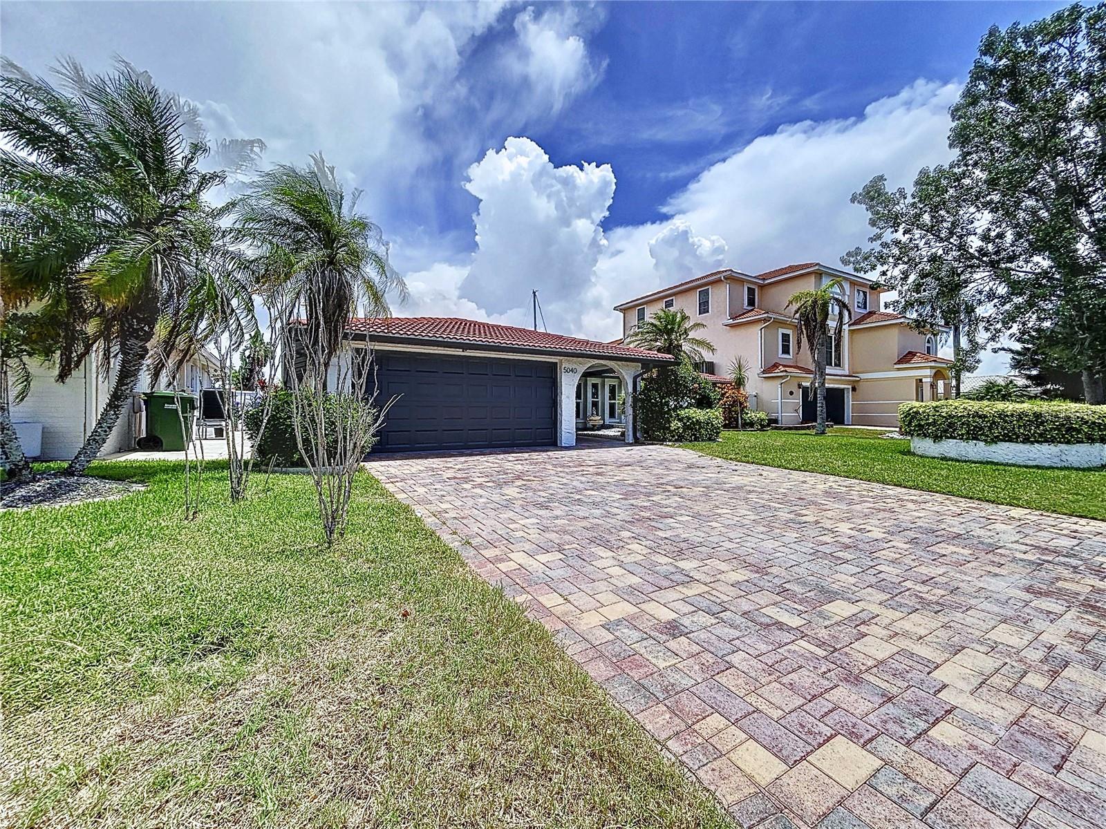 Fully Remodeled Waterfront Oasis in Gulf Harbors!
Welcome to 5040 Glenn Dr. - a stunning, move-in-ready, fully remodeled home located in the prestigious waterfront community of Gulf Harbors. This beautifully remodeled 4-bedroom, 3-bathroom residence offers the perfect blend of luxury, functionality, and Florida coastal living. As soon as you step inside, you're greeted with breathtaking water views and an open floor plan that seamlessly connects the living, dining, and kitchen areas—perfect for entertaining and everyday living. The layout is designed to maximize natural light and showcase the serene canal just beyond your backyard.
Situated on a deep water canal with direct access to the Gulf straight from your backyard, this home is a boater’s paradise. It features a private dock with a boat lift, allowing you to launch your Gulf adventures right from your backyard. Enjoy sunny days by the sparkling pool and tranquil evenings overlooking the water. Inside, the home has been fully remodeled with all work completed under permits. Updates include: new electrical and plumbing, brand-new windows, modern kitchen with quartz countertops, large-sized indoor space with sitting spaces, a dry bar facing the pool, updated bathrooms, and new LVP flooring throughout, two spacious master suites for flexible living, 2-car garage with a new garage door, split-bedroom layout for added privacy, located in a golf-cart friendly, deed-restricted community. Gulf Harbors offers residents access to a private beach club featuring a pristine sandy shoreline, 21 pavilions, charcoal grills, restrooms, and one of the best spots in the area to enjoy breathtaking sunsets. Annual beach membership is just $200 (optional). Residents may also join the Gulf Harbors Civic Association for $125 per year (optional), providing access to a variety of community clubs, including the Women's Club, Card Club, Fishing Club, Social Club, and more—plus use of two private community boat ramps. This golf cart–friendly community is conveniently located just 3.2 miles from historic downtown New Port Richey, home to Sims Park, which hosts outdoor concerts, festivals, and offers a variety of shops, restaurants, and breweries. This home is close to major highways, nature preserves, boat ramps, restaurants, and big box stores. Schedule your private tour today—this one checks all the boxes!