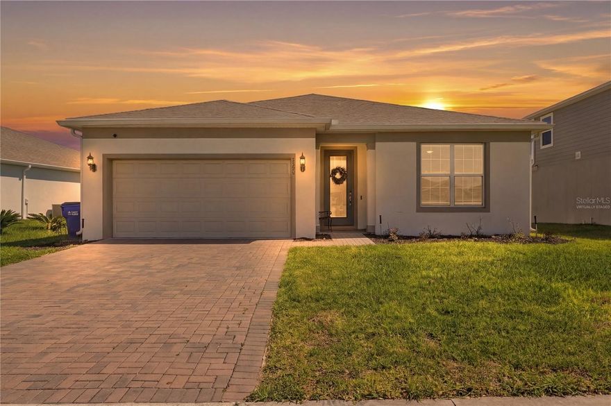 Welcome to this beautifully designed 3-bedroom and a flex room, 2-bath Spruce model by Pulte Homes, ideally located just off 192 near Narcoossee Road going south from Lake Nona, and on 192 to the east coast beaches. This rare floor plan, found in only select communities, features an expansive open layout with an oversized living room and elegant tray ceiling. The kitchen offers quartz countertops and flows seamlessly into the main living areas, perfect for everyday living and entertaining. The home also includes select smart home features and is compatible for additional upgrades. A flex room at the front of the home can serve as an office, playroom, or guest space. Two other bedrooms provide great additional space, while the spacious primary suite offers a comfortable private retreat. Enjoy outdoor living on the screened, extended covered patio, ideal for relaxing while taking in peaceful conservation views. The property is almost fully fenced, offering added privacy with just one side remaining. The garage features an upgraded epoxy floor, combining durability with a clean, finished look. Located in a community with NO CDD and low HOA, residents enjoy access to a pool, fitness center, and event room available for private gatherings and celebrations.