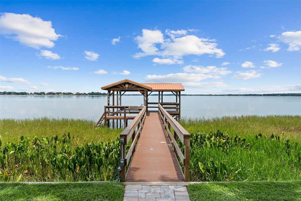Photo of 1412 Mosswood Dr, Leesburg, FL 34748 (MLS # O6432435)