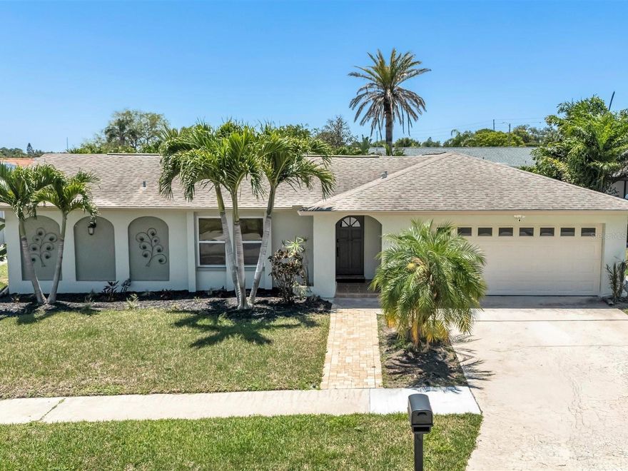 A beautifully updated four bedroom, two bath home with a two car garage and a sparkling saltwater pool, this property delivers the full Florida lifestyle just ten minutes from the Gulf beaches. Set in a desirable split plan layout, the home features a centrally located kitchen with granite countertops, real wood cabinetry, and a seamless flow to the main living areas—perfect for everyday comfort and entertaining. Major upgrades provide peace of mind, including a new roof (2014), new windows (2014), a new AC system (2020), and a 2014 impact slider door that opens directly to the outdoor oasis. 2020 new insulated impact garage door.  Also, 50 gallon hot water heater installed in 2019. Outside, the paver patio, bar pass through window, and expansive backyard create an inviting retreat for gatherings, grilling, or relaxing by the shimmering saltwater pool. With its thoughtful improvements, generous outdoor space, and unbeatable proximity to the coast, this home blends convenience, durability, and resort style living. Just 10 minutes from the Gulf beaches, this beautifully maintained 4 bedroom, 2 bath, split plan home features a spacious 2 car garage and a stunning saltwater pool perfect for year round Florida living. The centrally located kitchen offers granite countertops, real wood cabinetry, and excellent flow to the living and dining areas. Major updates include a new roof (2014), new windows (2014), new AC (2020), and a 2020 impact slider door leading to the outdoor oasis. The backyard is designed for entertaining with a paver patio, bar pass through window, and plenty of room to relax or play. The large yard provides additional space for gardening, pets, or future enhancements. With its thoughtful upgrades, inviting outdoor retreat, and prime location near beaches, shopping, and dining, this home is move in ready and offers exceptional value.