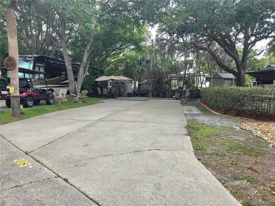 Welcome to 206 Longhorn Dr, ideally located in Phase 2 of River Ranch RV Resort. This peaceful retreat is thoughtfully designed for relaxation and outdoor living. Enjoy your own private oasis featuring a swing with umbrella, Adirondack chairs, grill, and firepit—perfect for entertaining or unwinding after a long day.

Lush privacy landscaping enhances the serene setting, while a full-sized shed provides convenient storage. Whether you're looking for a personal getaway or an investment opportunity, this well-appointed lot is ready to enjoy.

Lot is currently in River Ranch RV Resort Rental program, 75% to owner for rentals

***Golf Cart does not Convey with Lot sale***

River Ranch RV Resort is adjacent to Westgate River Ranch offering on site eateries and plentiful activities (at an additional cost) RRRVR owners currently receive 15% discount at the eateries and 10% discount at the WGRR waterpark.