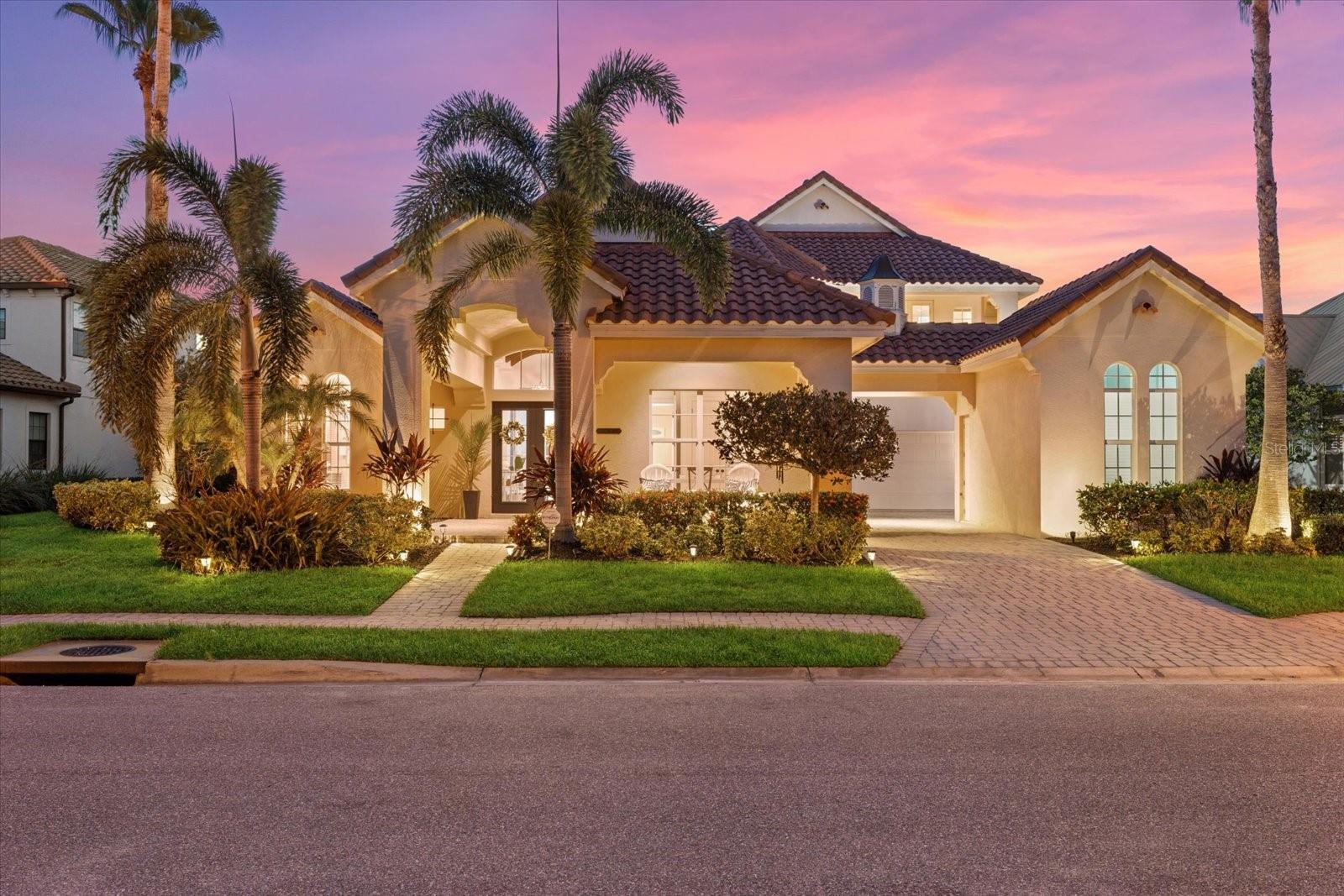 **NEW PRICE AND NEW EXTERIOR PAINT!!** Welcome to your slice of paradise! This exquisite, Arthur Rutenburg custom-built estate is nestled in the highly sought-after Harbour Walk community of The Inlets, offering an unparalleled living experience for boating enthusiasts and luxury seekers alike. Situated on a generously oversized saltwater canal lot with over 84 feet of pristine canal waterfront, this home features a 12,000-pound boat lift ready for your new boat or jet skis. With no canal lifts or bridges to slow you down, you can enjoy a quick 3-minute ride out to the Manatee River for direct access to Tampa Bay, the Gulf of Mexico, and Southwest Florida’s Intracoastal Waterways. Embrace the ultimate Florida lifestyle with opportunities for fishing, kayaking, jet skiing, cruising, sandbars, water sports, dining at waterfront restaurants, or simply soaking in the breathtaking Gulf sunsets. Boasting over 4,500 square feet of sophisticated, high-end living space, this home is designed for comfort and style. With 5 bedrooms and 5 bathrooms, there’s ample space for family and guests. The main floor offers a custom chef’s kitchen perfect for culinary creations, a spacious great room overlooking the outdoor pool area, a formal living room, a formal dining room, an office, and two guest bedrooms with two full bathrooms. The grand primary suite features a spa-like primary bath for your personal retreat. The second level features a loft with a pool table and wet bar, a media room, a versatile flex room, two guest bedrooms with ensuite bathrooms, and two private patios showcasing stunning views. Step outside to the expansive outdoor oasis that is designed for entertaining and comes equipped with a custom infinity pool and spa and an outdoor kitchen setup with a grill and fridge. Follow the path to your very own private dock where you can bask in the beautiful Florida weather, watch for fish, dolphins, and manatees, or relish the serene sunsets. Just a short drive away from IMG Academy, University Town Center, Downtown Bradenton, Downtown Sarasota, St. Petersburg, Tampa, and the world-famous sugar sand beaches of Florida’s Gulf Coast. This rare opportunity to own a stunning Arthur Rutenburg custom home in one of the most desirable boating communities in the area won’t last long. Don’t miss your chance to make this extraordinary property your own! Contact us today to schedule a private showing and start living the Florida dream!