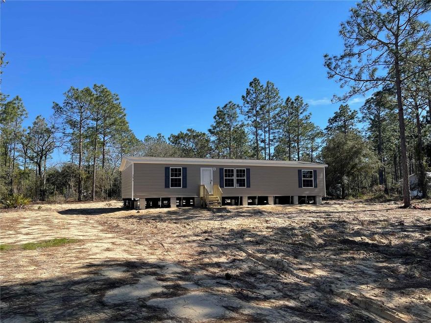 Under Construction. Welcome to peaceful country living in this brand-new Champion “Burnett” manufactured home offering 3 bedrooms, 2 bathrooms, and 1,493 sq. ft. of thoughtfully designed living space, perfectly situated on a spacious 1.25-acre lot in Williston, FL. This property delivers an ideal blend of comfort, privacy, and convenience. This property offers the perfect blend of comfort, privacy, and convenience. Step inside to an inviting open-concept layout designed for both everyday living and entertaining. The thoughtfully designed floor plan provides generous living areas, a functional kitchen with ample cabinetry and counter space, and comfortable bedrooms that offer a relaxing retreat at the end of the day.  Outside, the expansive 1.25 acres provide endless possibilities — room for gardening, outdoor hobbies, additional storage buildings, or simply enjoying Florida’s beautiful sunsets and star-filled skies. Convenient Location approximately 15 miles to Dunnellon, 22 miles to Ocala, 30 miles to Gainesville, and 40 miles to Crystal River. Local Attractions & Outdoor Recreation - Goethe State Forest – miles of scenic trails for hiking, horseback riding, and nature exploration, Rainbow Springs State Park – crystal-clear springs, kayaking, and swimming, World Equestrian Center (Ocala) – premier equestrian events and dining, Cedar Lakes Woods & Gardens – unique botanical garden experience, and Devil’s Den Prehistoric Spring – snorkeling and diving destination. Enjoy the tranquility of rural living while still being within comfortable driving distance to shopping, dining, medical facilities, and entertainment. This move-in-ready home is a wonderful opportunity to own a slice of North Central Florida charm.