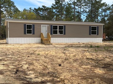 Photo of 2671 SE 133rd Terrace, Morriston, FL 32668 (MLS # OM717696)