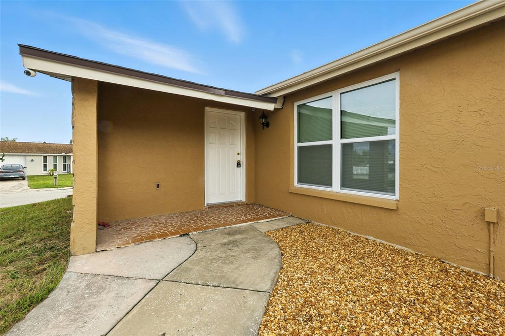 Photo of 9239 Palm Avenue, Port Richey, FL 34668 (MLS # TB8530587)