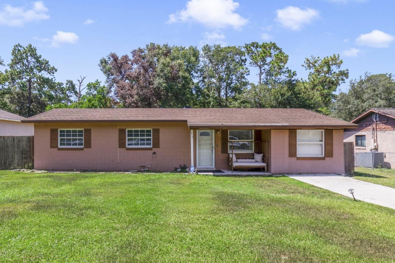 This property qualifies for a credit up to $4125 through the seller's preferred lender ~ Major updates, smart features, and space to spread out – this Apopka block home checks all the boxes! Sitting on a generous .23 ACRE LOT, this over 2,000 sqft home delivers flexibility, comfort, and peace of mind with some of the big ticket items already tackled; NEW WATER HEATER (2021), OWNED WATER SOFTENER (2021), and a NEW AIR HANDLER (2020). The NEW WOOD FENCE adds privacy to the backyard, while a long driveway, COVERED CARPORT and attached WORKSHOP provide ample parking and storage. Inside you will find a versatile layout with 3 bedrooms and potential for a 4th, giving you room to set up however you might need - whether that is a home office, guest space, play area or home gym. You will love that there is NO CARPET anywhere in the home, the UPDATED BATHROOM, and the abundance of light flowing through the Florida room, offering additional flexibility. Tech-savvy upgrades like Alexa compatible smart switches, a Nest thermostat and doorbell, and the security system add modern convenience, while classic touches like crown molding in the kitchen and family room bring timeless style. The kitchen is perfectly situated at the heart of the home and features desirable STAINLESS STEEL APPLIANCES, breakfast bar and a great mix of cabinet and drawer storage, all open to the family room – a great setup for everyday living and entertaining. Up front off the sizable foyer you also have formal living and dining spaces for even more versatility. Outdoor living is just as inviting with a covered front porch, rear patio, and a yard with beautiful mature trees. Located in an established community with NO HOA, this home puts you close to everything – just minutes from SR 429, shopping, dining, the Northwest Recreation Complex, Wekiwa Springs State Park, and Lake Apopka. With updates already done, the added bonus of smart features, and space to make it your own, this Apopka home is ready for its next owner. Is that you? Call today to schedule a tour!