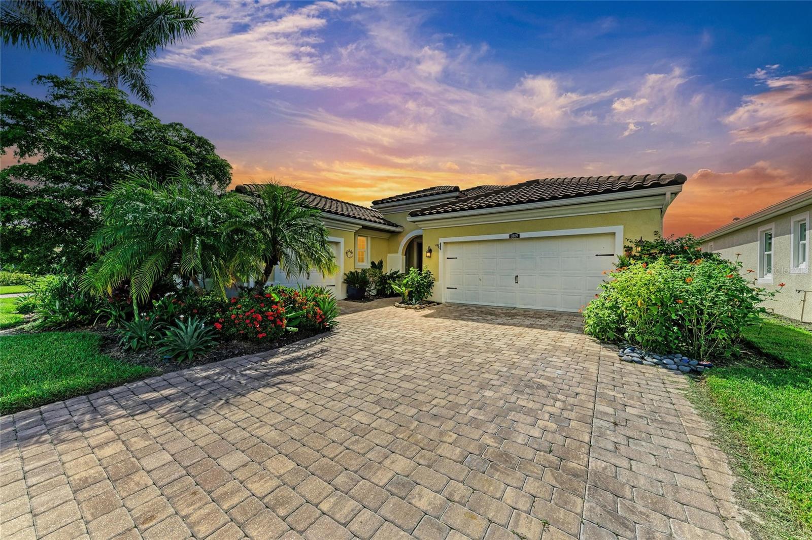 Experience the comfort and convenience of Florida living in this Mattamy Homes Harborside model, offering 2,422 sq. ft. of thoughtfully designed space in the gated, maintenance-free community of Renaissance at the West Villages. This 3-bedroom, 3-bath, 3-car garage home includes a versatile flex space, ideal for a home office, den, or craft room. The chef’s kitchen is a true showpiece, featuring built-in KitchenAid appliances, espresso cabinetry, solid-surface countertops, a massive center prep island, and an expansive walk-in pantry. With its open-concept layout, the home is designed for seamless entertaining and easy everyday living. Step outside to the impressive 22’ x 25’ panoramic screened lanai, where serene lake views with three sparkling fountains create a picture-perfect setting. The oversized primary suite is a private retreat with beautiful water views, while the spa-like en-suite bath offers split vanities, a soaking tub, a walk-in shower, and a massive walk-in closet. Two additional bedrooms provide comfortable space for family or guests. A split 3-car garage, widened driveway, and lush tropical landscaping add to the curb appeal. As a resident of Renaissance, you’ll enjoy resort-style amenities including a sparkling pool, pickleball and tennis courts, a modern fitness center, and a full calendar of social events. Ideally located just 5 minutes from Wellen Park, you’ll have quick access to shopping, dining, A+ rated schools, top hospitals, and the Atlanta Braves Spring Training facility—with pristine Gulf beaches only 20 minutes away. This home perfectly combines space, function, and location in one of the area’s most desirable communities. Schedule your showing today and make it yours!