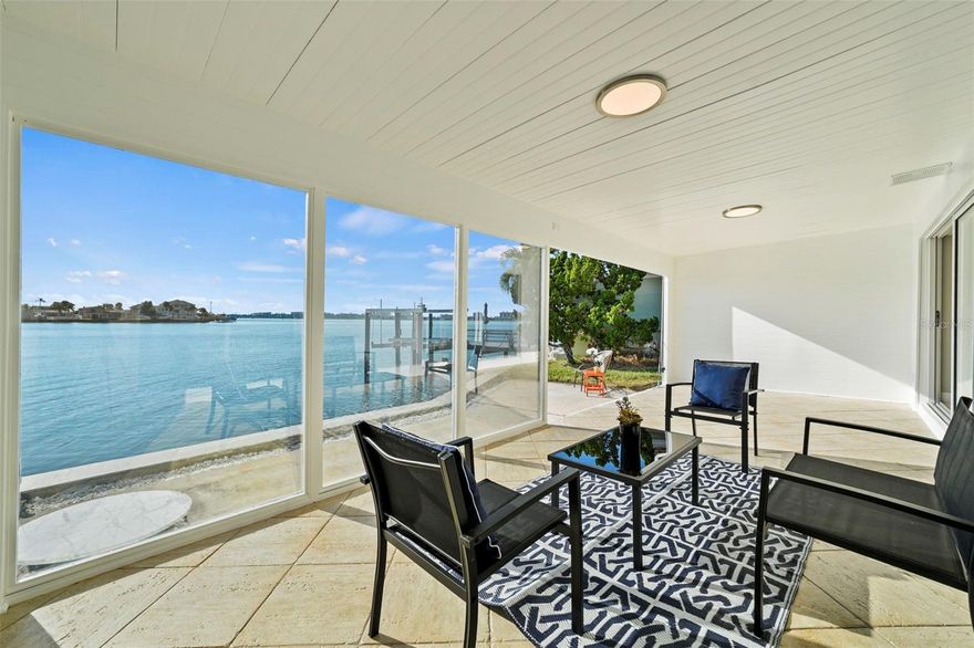 Desirable Gated 55+ Waterfront Boating Community – Boca Ciega Point on the Madeira Beach Intracoastal! You don’t need to be a boater to enjoy this exceptional lifestyle. Welcome to a coveted CORNER Villa (#642 Blvd South), a beautifully fully remodeled, 2-bedroom, 2-bath residence with a den and sweeping south-facing water views. From the moment you enter, you’ll be drawn to the water view, showcased through the bright, open layout and the spacious semi enclosed lanai—an ideal spot for enjoying fresh air, dolphin and manatee sightings, and fishing right outside your villa. The interior has been fully renovated with new flooring throughout, millwork, stainless steel kitchen appliances, cabinetry, remodeled baths, new plumbing, electrical systems, ceiling fans and lighting. The generous primary suite accommodates a king-size+ bed and features an en-suite bathroom and walk-in closet. Unique to this floor plan, the additional den, offers flexibility for an office, hobby room, or guest space. Other Villa features include Hurricane Impact Rated doors and windows, an attached 1-car garage housing a double wash tub, laundry hookups, new water heater, and your very own private courtyard for perhaps grilling or planting herbs/landscape or a place for grandchildren to play! Boca Ciega Point provides a true resort-style experience, offering tennis, a heated pool, pickleball, bocce, ground shuffleboard, a fitness center, card and game rooms. Additional community amenities include, a Boat Club, community grill area, two social rooms, and even a convenient air station for residents’ tires. HOA covers fiber-optic cable and internet, water, sewer, trash, building and flood insurance, exterior maintenance, on-site management and groundskeeping, along with Envera; a virtual gate security system. Association #9 is known for its strong reserves and excellent management. Pet friendly, one pet up to 25 lbs. This prime location sits 2 miles from Madeira Beach’s Archibald Park, where you’ll find a food concession, chair and umbrella rentals, and beautiful sunset views. Restaurants, pubs, Publix, Seminole City Center, Tyrone Mall, marinas, and the VA Hospital are all nearby. Pinellas County’s #1 tourist attraction, John’s Pass Village, provides boat/jet ski rentals, parasailing, dolphin watch tours, fishing tours and more for your visiting guests. Downtown St. Petersburg is nearly 13 miles away offering fantastic night life and the nation’s 3rd longest public waterfront park. The association was impacted by Hurricane Helene. Villa #642 offers the perfect blend of comfort, convenience, and waterfront living—whether you boat or not. Pricing reflects the option for the new owner to install a custom design dock to meet their waterfront needs in PARADISE! Show ready!