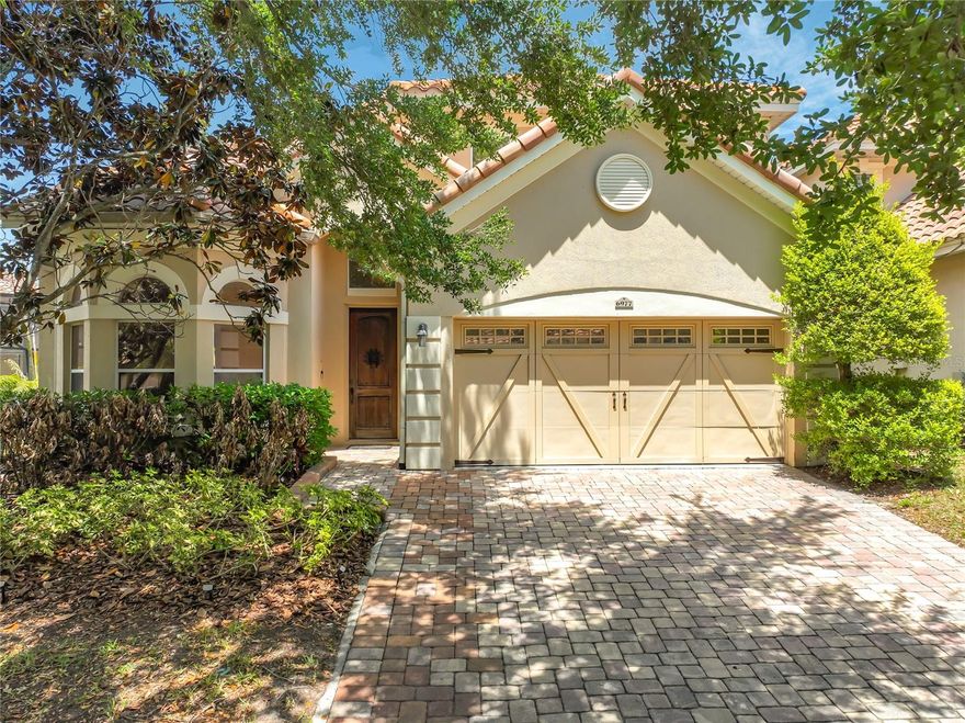 Nestled within the exclusive gated community of Toscana, this stunning Mediterranean-inspired residence offers the perfect blend of luxury and the relaxed Florida lifestyle. Property comes with a private electrical heated resort style pool and hot tub, boasting 4 bedrooms, 3.5 bathrooms, and nearly 3,000 square feet of meticulously designed living space, this home is a true standout in the heart of Dr. Phillips. As you enter you be drawn to the flex room which is ideal as a study or office space and comes with a new custom built electrical fire place  Property boasts high ceilings, crown molding, and a majestic wood-and-wrought-iron staircase. The Kitchen as a chef’s dream featuring 42-inch cabinetry, granite countertops, a full stainless steel appliance package (with built-in ovens), and a breakfast nook with serene pool views. The Primary bedroom is conveniently located on the first floor with new wood flooring, the primary suite offers dual vanities, a deep soaking tub, and custom closet organizers. The second level features three generously sized bedrooms and a versatile loft space, ideal for a home office or media room. Located close to restaurant row with world class dining and zoned for Dr Philips Elementary and southwest middle. This home combines the security of a manned gate with the convenience of a "lock-and-leave" lifestyle. Whether you are seeking a primary residence or a high-end second home. Property has had the following additional updates, all new carpet including the staircase, upstairs bedrooms and also new paint throughout, Engineered hard wood flooring in loft area on the second floor. A new Hot Water heater (2024), New microwave and new range oven, AC has been serviced every 6 months. The garage comes with custom shelving and overhead racking system. HOA takes care of the Front lawn.