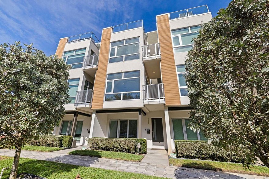 One or more photo(s) has been virtually staged. LIV233 is an exclusive boutique enclave of three luxury townhomes ideally located near Beach Drive, The Vinoy, and the heart of Downtown St. Pete. These four-story, three-bedroom, 4.5-bath plus den contemporary residences feature private elevators, full home automation, surround sound on every level, custom open staircases with glass railings, floor-to-ceiling windows, three balconies, and a private rooftop terrace with views. The chef’s kitchen offers a 14-foot island, waterfall-edge quartz countertops, floor-to-ceiling wood cabinetry, gas range, wine cooler, and Bosch appliances. French white oak and ceramic tile flooring flow throughout. The primary suite includes a private balcony, dual walk-in closets, soaking tub, walk-in shower, and double-sink vanity. Masonry construction with contemporary cypress accents, expansive private outdoor space, one garage space, one covered exterior space, and private storage complete this exceptional offering.