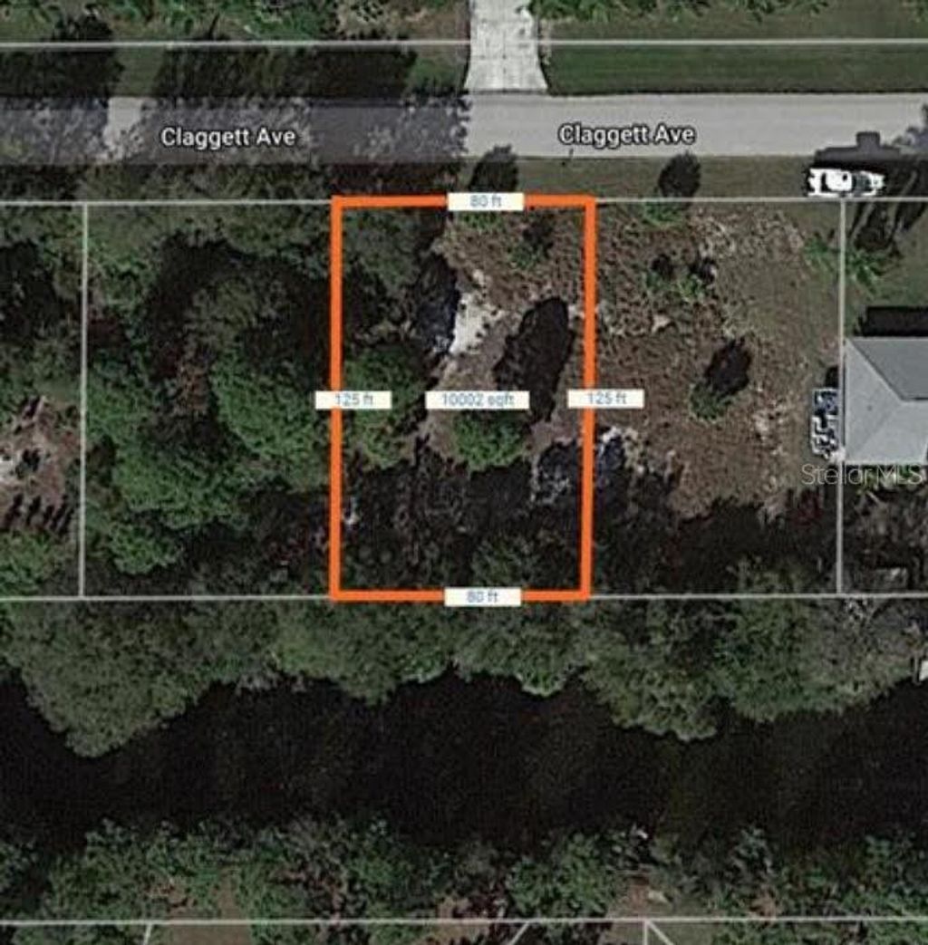 Photo of 11417 Claggett Avenue, Port Charlotte, FL 33981 (MLS # D6141039)