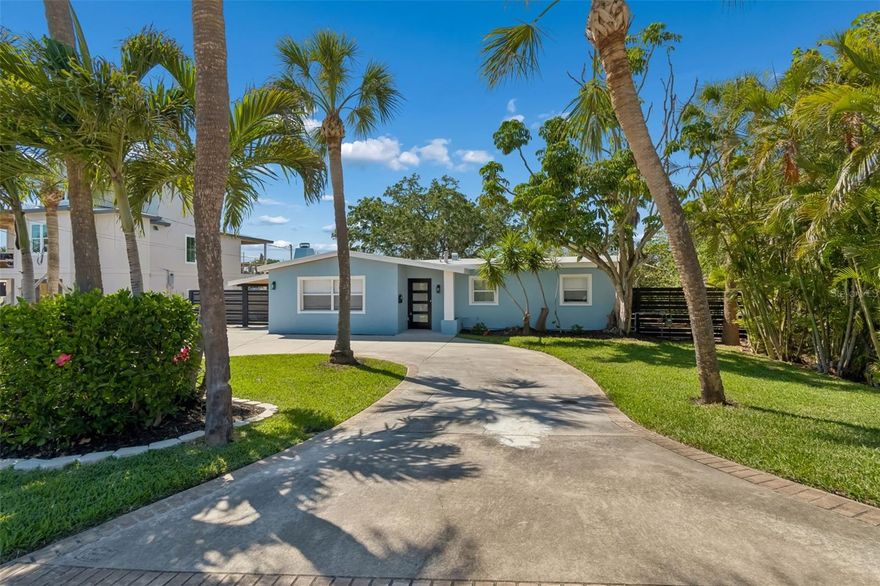 Welcome to your private waterfront sanctuary—an exceptional opportunity to own a beautifully renovated Mid-Century Modern home on a rare wraparound lot boasting approximate 180 feet of shoreline along Butterfly Lake. Nestled in the highly sought-after Shore Acres community, this property offers unmatched privacy, lush natural surroundings, and direct water access for the ultimate Florida lifestyle. This thoughtfully updated 3-bedroom, 2-bath residence spans 1,564 square feet of light-filled living space, blending timeless architectural character with modern upgrades. Inside, the open-concept living room is anchored by a striking, upgraded fireplace and enhanced by soaring volume ceilings, expansive windows, and stunning water views throughout. Designed for both relaxation and entertaining, the spacious floor plan flows seamlessly through double French doors to an extraordinary backyard oasis. The outdoor space is framed by mature landscaping, including a majestic oak tree and mangroves that line the water’s edge—creating a peaceful, private retreat with room to add a pool. Enjoy true waterfront living with a private dock—perfect for boating, kayaking, or fishing. Spend your evenings taking in breathtaking sunsets in your own tranquil setting. The primary suite serves as a serene retreat, featuring beautiful water views and a tastefully updated en-suite bath. Additional upgrades include updated electrical and plumbing systems, replaced composite wood decking, and newly refreshed exterior landscaping—offering move-in-ready convenience with room to personalize. Ideally located just minutes from the newly built YMCA, as well as quick access to vibrant downtown St. Petersburg—known for its elegant dining, waterfront parks, boutique shopping, and thriving arts scene.  Don’t miss this exceptional opportunity to own a beautifully upgraded home in one of St Pete’s most desirable neighborhoods. Schedule your private showing today and experience all this remarkable property has to offer.