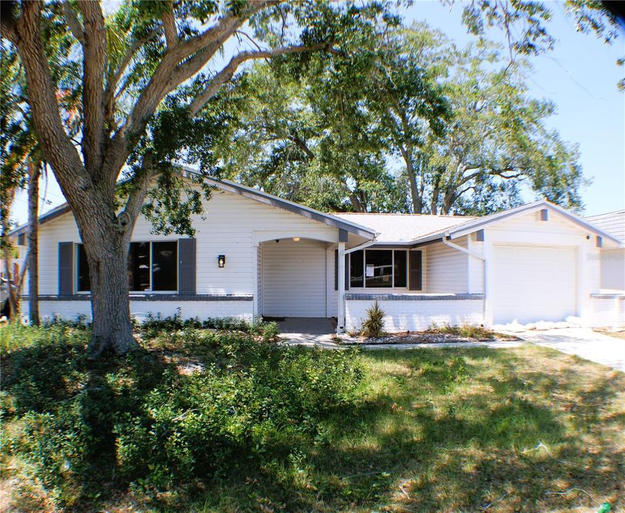 Don’t miss this beautifully updated corner-lot home with serene pond views. Featuring a newer roof (2022) and a new HVAC system (2023), this property offers peace of mind along with modern upgrades throughout.

Inside, the home has been fully remodeled with a brand-new kitchen, updated bathrooms, and all-new flooring. The layout includes two spacious bedrooms and two full bathrooms, along with multiple living spaces—perfect for both relaxing and entertaining. Enjoy a welcoming living room, a separate family room, and a large Florida room that provides additional space to unwind while taking in the peaceful surroundings.

Additional highlights include a one-car garage and a desirable corner location that enhances both privacy and curb appeal.