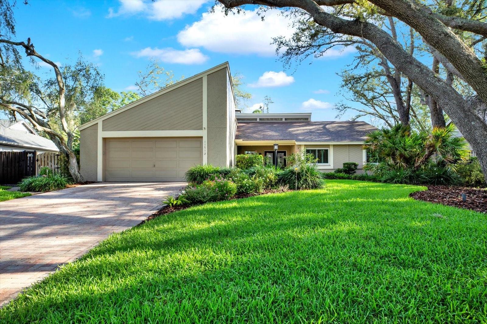 WELCOME TO A BEAUTIFUL MODERN HOME LOCATED ONA QUIET CUL-DE-SAC IN A HIGHLY DESIREABLE CENTRAL CARROLLWOOD NEIGHBORHOOD MINUTES FROM TAMPA'S PRIME LOCATIONS. THIS IS A THREE BEDROOM, TWO AND A HALF BATH, POOL HOME WITH A TWO CAR GARAGE.HOUSE INCLUDES NEW STAINED GLASS FLOOR DOORS, NEW ENERGY EFFICIENT DOORS, AND WINDOWS WITH CUSTOM PLANTATION SHUTTERS. THIS HOUSE IS PERFECT FOR ENTERTAINING WITH ITS PATIO DOORS OPENING TO A SPACIOUS COVERED LANAI, WHICH OVERLOOKS A BEAUTIFULLY LANSCAPED PRIVATE BACKYARD AND POOL AREA. KITCHEN ALSO OPENS TO A GRILLING DECK ON THE SIDE OF THE HOUSE WITH CONTINUOUS ACCESS TO THE POOL AREA.
EXTERIOR FRONT AND BACK OF THE HOUSE HAVE PROFESSIONALLY INSTALLED LANDSCAPE LIGHTING FEATURING THE GREAT GRAND OAK TREES AND BEAUTIFUL GARDENS. ENTRY TO THE HOUSE PROVIDES CLEAR VISIBILITY TO THE LIVING SPACES, POOL, AND YARD. THE LIVING SPACES INCLUDE PORCELAIN TILE FLOORS ,AN OVERSIZED LIVING ROOM WITH CATHEDRAL CEILINGS, FIREPLACE AND AND WALL TO WALL SHELVING DINING AND KITCHEN AREAS HAVE OVERSIZED WINDOWS WITH GREAT EXTERIOR VIEWS AND LOTS OF LIGHT. KITCHEN FEATURES NEW APPLIANCES, GRANITE TOPS, AND AMPLE STORAGE PLACE. HALF BATH, OVERSIZED LAUNDRY ROOM WITH EXTRA STORAGE AND PREP AREA LOCATED OFF THE KITCHENWITH ACCESS TO THE GARAGE. THE HOME FEATURES A PRIVATE MASTER SUITE WITH AN EN SUITE BATHROOMAND A NEW CUSTOM DESIGNED WALK-IN CLOSET. THE OTHER TWO BEDROOMS ARE GENEROUSLY SIZED AND A RE LOCATED ON THE OPPOSITE SIDE OF THE HOUSE WITH ITS OWN BATHROOM.
SPECIAL FEATURES NEWER AIR CONDITIONING SYSTEM, A SALTWATER SYSTEM VS CHLORINE FOR POOL WHICH PROVIDES ECONOMICAL MAINTENANCE SOLUTION FOR THE POOL. EXTERIOR BRICK PAVERSAT DRIVEWAY, ENTRANCE WALKWAY, POOL DECK, AND LANAI AND WOODEN DECK AT SIDEYARD WINDING AROUND THE LANDCAPED GARDEN.
THIS HOUSE PROVIDES ALL THE COMFORTS NEED IN A HOME AND IT IS READY TO WELCOME YOU .
THIS HOME IS A MUST SEE!!