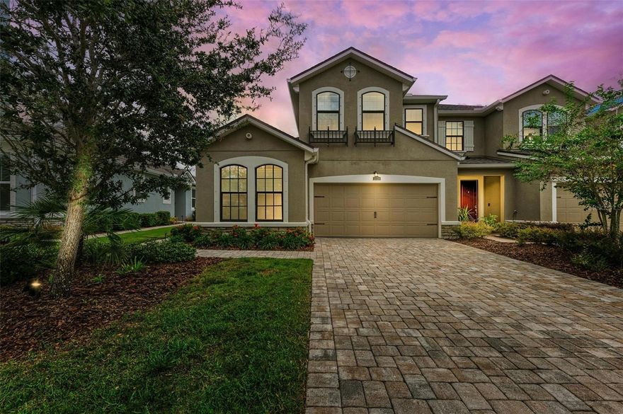 PRICE IMPROVEMENT!  Seller is offering buyer a $5K Closing Cost incentive with an acceptable contract.  Welcome to this exquisite and perfectly appointed townhome that lives like a single-family residence within Harmony at Lakewood Ranch. This well-appointed and re-designed second floor Driftwood End residence offers versatile living spaces, featuring two bedrooms and two baths on the lower level, with a third bedroom and bath, open loft, and an oversized air-conditioned closet that can be used for multiple purposes, all situated on the second floor. The attention to detail is evident with an abundance of crown molding, including some in the bathrooms, 8’ interior doors downstairs, and beautiful window treatments, showcasing a sense of luxury. Upon arrival, a meticulously designed paver walkway with outdoor lighting leads to the side entry, where you enter a welcoming great room showcasing an impressive wood staircase. Adjacent to the great room lies a chef’s kitchen with a picturesque window, displaying 42” cabinetry, granite countertops, stainless-steel appliances, and a generously sized island—perfect for both meal preparation and casual dining. The dining room, elegantly illuminated by decorative lighting, offers access to the covered lanai, seamlessly blending indoor and outdoor living. The lanai is covered yet open to the outdoors, providing easy access and a perfect spot to relax and enjoy the beautiful surroundings. The owner’s suite, a sanctuary of self-indulgence and relaxation, features an adorned tray ceiling, adding a touch of sophistication with access to the lanai through sliding doors and a spacious walk-in closet. The en-suite bath features a granite countertop with dual vanities, large walk-in shower, upgraded lighting, and a linen closet for added convenience. Ideal for family or guests, the first-floor guest bedroom features a beautiful front window and closet. Additionally, the first floor accommodates a dedicated laundry room equipped with a washer, dryer, and shelving. On the upper level, the third bedroom offers privacy and comfort. There is also a dedicated loft area, perfect for a home office or creative space. As a convenience, an oversized closet has been cleverly converted into a multi-purpose room, featuring air-conditioning and newer flooring. A full bathroom is situated upstairs next to the 3rd bedroom, providing convenience and functionality. The two-car garage is a bonus for all your storage needs. The low HOA fees include grounds maintenance and the exclusive community amenities are within a short distance. Residents will enjoy a fitness center, pool, and tot lot, this townhome provides a resort-style living experience. Harmony at Lakewood Ranch is centrally located and offers a secret trail leading to Roger Hill Park, proximity to top-tier schools, and shopping options within less than a mile radius. Lakewood Ranch is recognized as the #1 master-planned community for all ages and recipient of numerous awards, boasts 150 miles of parks and trails, easy access to world-class beaches, the UTC shopping district, and an array of other desirable amenities. Your satisfaction with this property is assured; it is an opportunity not to be missed, combining luxury and convenience in one exceptional residence.