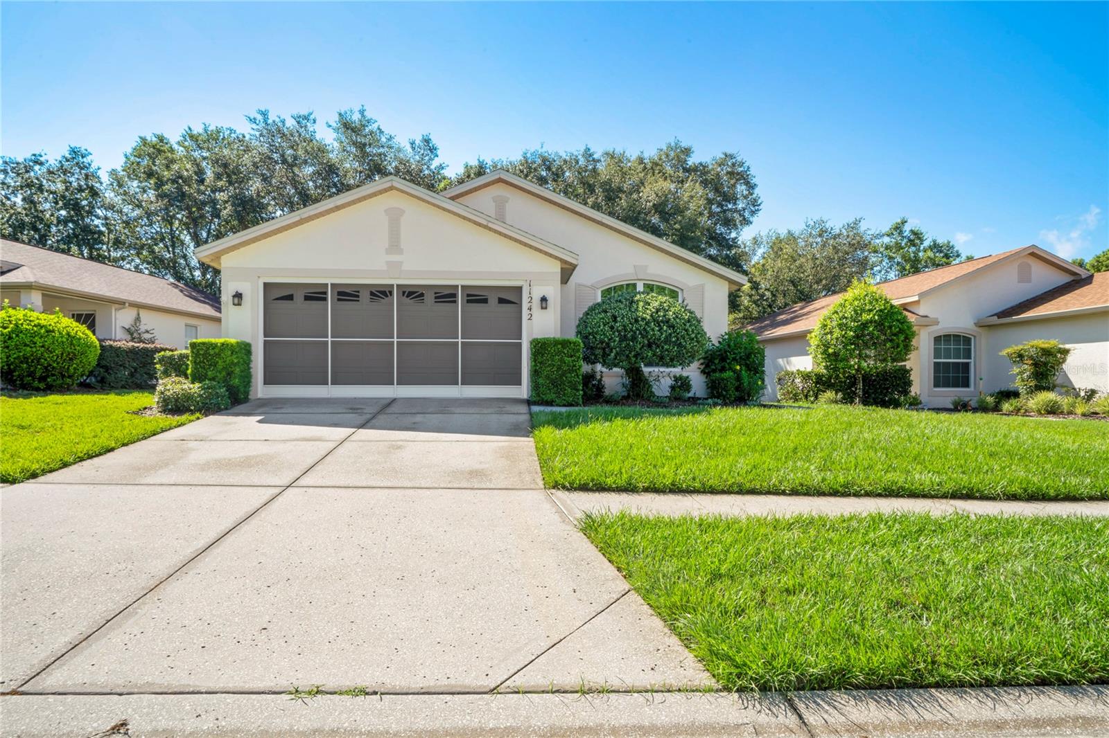 Beautifully Maintained Bermuda Model.
Discover this charming 2-bedroom, 2-bathroom + den patio home, perfectly situated on a serene semi-private lot with a peaceful parklike view — and no backyard neighbors. Located in the sought-after 55+ community of Wellington at Seven Hills, this home combines comfort, quality, and a host of recent updates and upgrades. Step inside to an open floor plan where the great room and dining area flow seamlessly together under vaulted ceilings, creating a bright and inviting living space. The eat-in kitchen offers abundant cabinet storage, a pantry, and plenty of counter space for meal prep and entertaining. Sliding doors lead from the great room to the screened lanai, perfect for enjoying Florida’s beautiful weather. The primary suite offers a large walk-in closet and a private bathroom with a walk-in shower and elegant stone-look flooring. The guest bedroom is privately located near the second bath, while the den provides flexible space for a home office, reading nook, home gym, or hobby room. The inside laundry room includes a laundry sink, washer and dryer. Recent Updates & Upgrades:
Roof (2022): New with upgraded SA SBS underlayment for improved energy efficiency, impact resistance, and fire protection.
Windows (2021): PGT WinGuard hurricane-proof replacements for added safety, noise reduction, UV protection, and peace of mind.
Flooring (2020): AMORIM WISE waterproof, kid- and pet-friendly flooring — luxury vinyl look with eco-friendly, chemical-free materials.
Garage Screen (2025): Enhances ventilation, privacy, and pest protection. newly applied epoxy garage floor.
Heat Pump (2016): Well-maintained with regular semi-annual service.
Community Lifestyle:$225 HOA fee a month includes: Fiber optic internet and TV; multifunctional clubhouse, pool, spa, pickleball and tennis courts; Bocce ball, Billiard room, exercise room. Lots of clubs, community trips, parties, bingo and so much more. You can be as busy as you wish. When you visit the clubhouse ask for a copy of the News and Views, you will find it a fascinating look into the community. Included with your monthly maintenance fees of $204 is Lawn Maintenance, outside painting every 10 years, sprinkler care and more- Please see attached document expectations of Wellington HOA maintained home to see what is covered in your maintenance package.
Enjoy your days with no worry of outside maintenance so you can have more fun with your friends and family
Just 45 minutes from Tampa, and close to beaches, kayaking, and fishing, this home offers the perfect balance of relaxation, activity, and convenience.