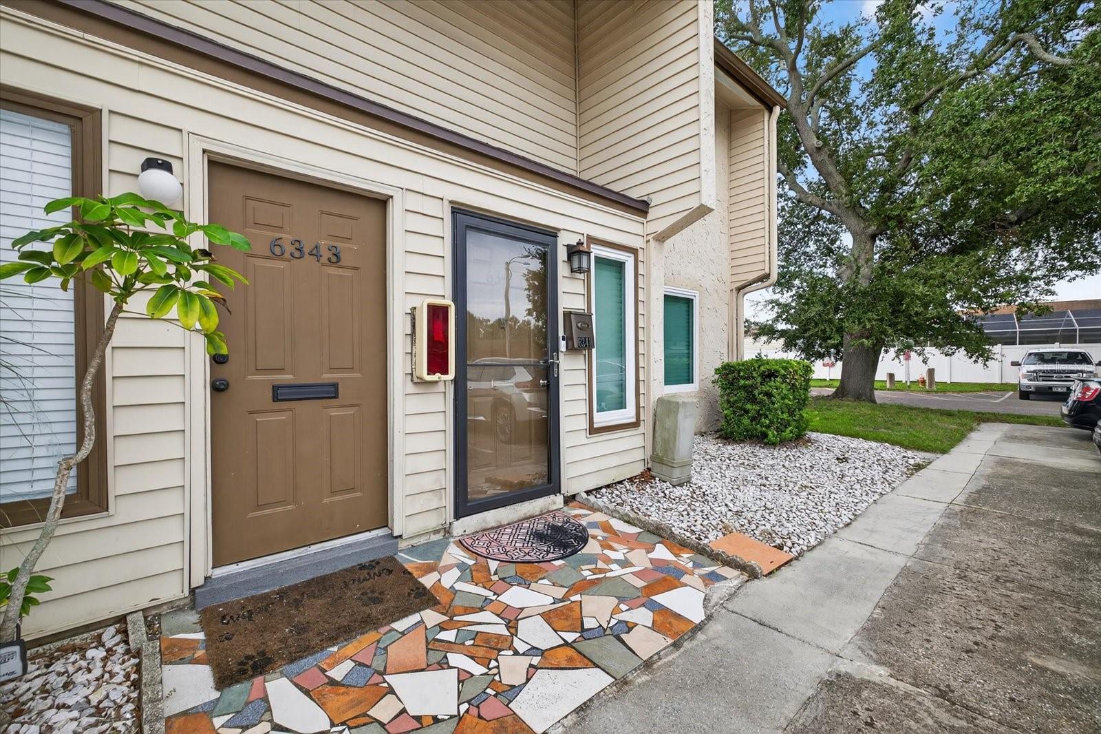 Enter this beautifully remodeled unit and you are greeted by a large living room connecting to dining and open kitchen combo perfect for entertaining. A updated half bath sits off the living room dining area. The kitchen features granite countertops with new stainless appliances. An oversized pantry allows for plenty of storage. Upstairs features two large bedrooms, jack and jill style full bathroom and ample sized walk-in closets in each room. Located in Barkwood Square an HOA community which includes a private pool and clubhouse, water, trash, ground maintenance, pest control and more included in the HOA! Located centrally to all the destinations St Pete and Tampa Bay has to provide. Including a quick 20 minute commute to Tampa International Airport or world renowned beaches. Conveniently nearby grocery, dining and shopping. Call for a showing today! Flooring in living room experienced some damage. Seller's willing to give credit to replace floors prior to closing.