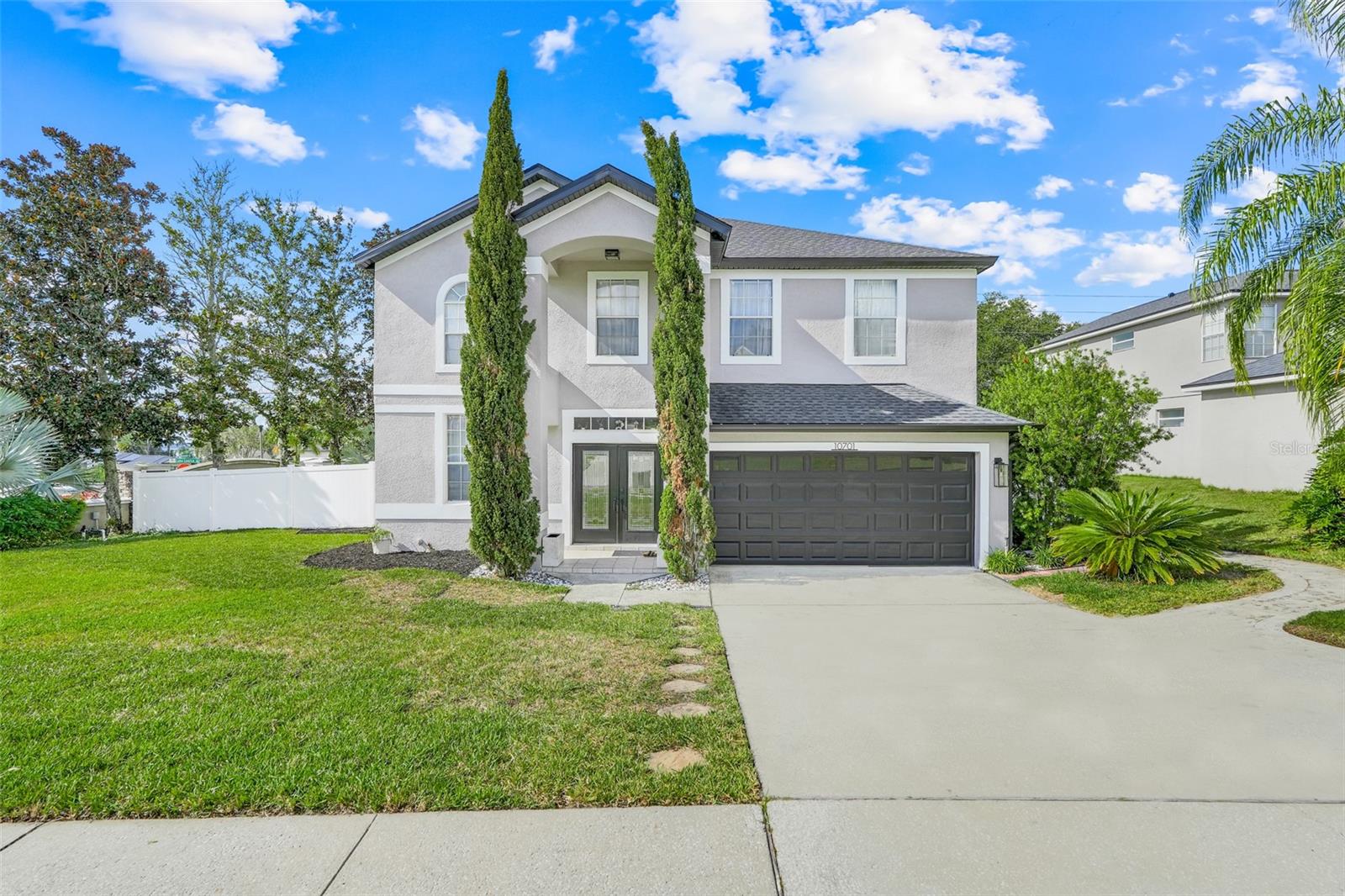 This beautifully maintained 4-bedroom, 2.5-bath home has been lovingly cared for and thoughtfully updated throughout. You’ll immediately notice the warm, modern touches — from stylish flooring and fresh paint to updated lighting and fixtures that make every room feel inviting. The open-concept living area flows into a bright, modern kitchen featuring granite countertops, stainless steel appliances, and ample cabinet space — perfect for everyday living and entertaining. The spacious primary suite offers a relaxing retreat with a beautifully updated en-suite bath, generous closet space, and an extended sitting area ideal for reading, a workspace, or a cozy lounge nook. Additional bedrooms are well-sized and versatile, ideal for family, guests, or a home office. Step outside to a private backyard featuring an extended paver patio and low-maintenance artificial turf — perfect for entertaining, relaxing, or enjoying the outdoors year-round. Conveniently located near shopping, dining, top-rated schools, and major highways, this home is just minutes from the 429 and close to the exciting new Olympus community — offering a wonderful combination of comfort, style, and a prime location in Clermont’s growing area.