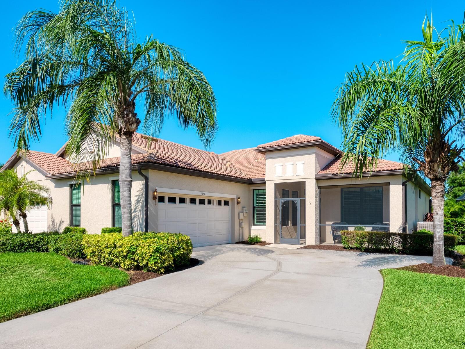 Experience resort-style living at Venetian Falls in this immaculate Botticelli paired-villa! Located in an active, gated, 55+ community, this home offers peace of mind with impact windows and front door, reinforced garage door, and storm shield for the lanai—all providing extra protection and energy efficiency. Enjoy relaxing or dining outdoors on your lanai overlooking the serene, long lake views. Inside, the kitchen offers a bright, open layout with stainless steel appliances, granite countertops, 42” wood cabinets, skylight, dinette, and pantry. Further features include a screened front entry and sitting area, updated primary suite, crown molding, plantation shutters, skylight in the living room, and wood laminate floors in the main living areas, den, and guest bedroom. The oversized 2-car garage has a durable polyaspartic garage floor finish adding a clean look and ease of maintenance. Meticulously maintained and boasting excellent curb appeal, this villa is truly move-in ready. Venetian Falls offers resort-style amenities including a clubhouse with full-time activity director, heated lap pool, heated resistance pool, fitness center, billiards, bocce, on-site management, and so much more! The HOA fee covers lawn care and front shrub trimming, irrigation, roof cleaning, exterior paint, internet, and basic cable. Don't miss out on this beautiful, worry-free home in a gated community just minutes from Venice beaches, dining, and shopping!