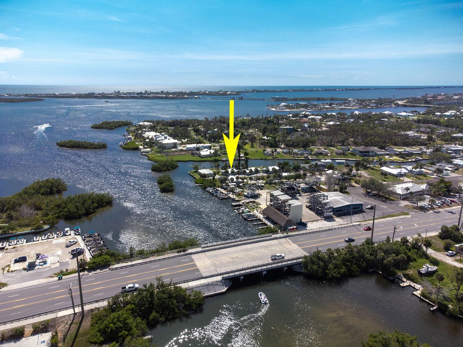 Imagine a blank canvas on over 350 feet of pristine waterfront, an incredibly rare find in Southwest Florida. This hurricane-impacted property, zoned RMF-10 (Residential Multi-Family, 10 units per acre), offers an extraordinary opportunity to rebuild and redefine your coastal dream. Currently featuring four duplexes, comprising five two-bedroom, one-bath units and three one-bedroom, one-bath units, the potential for a thriving vacation rental enterprise is immense, building on its successful history. Alternatively, envision transforming this expansive parcel into your own magnificent private waterfront paradise.
With a sturdy seawall and a well-positioned dock, you'll enjoy unparalleled access to the open waters of the Intracoastal Waterway and the Gulf of Mexico, with no bridges to hinder your boating adventures. This prime location promises world-class fishing right from your backyard, stunning Gulf beaches just a short boat ride away, and an array of vibrant waterfront dining options within easy reach. While the property has sustained damage, this presents a unique chance to design and construct a property tailored to your exact specifications, capitalizing on the highly sought-after waterfront lifestyle and the RMF-10 zoning for maximum return on investment. The possibilities are truly boundless for those with vision and a desire for an exceptional waterfront existence.