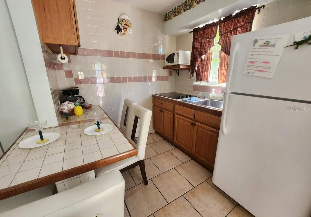 Photo of 415 Hamden Drive, Clearwater, FL 33767 (MLS # TB8546491)