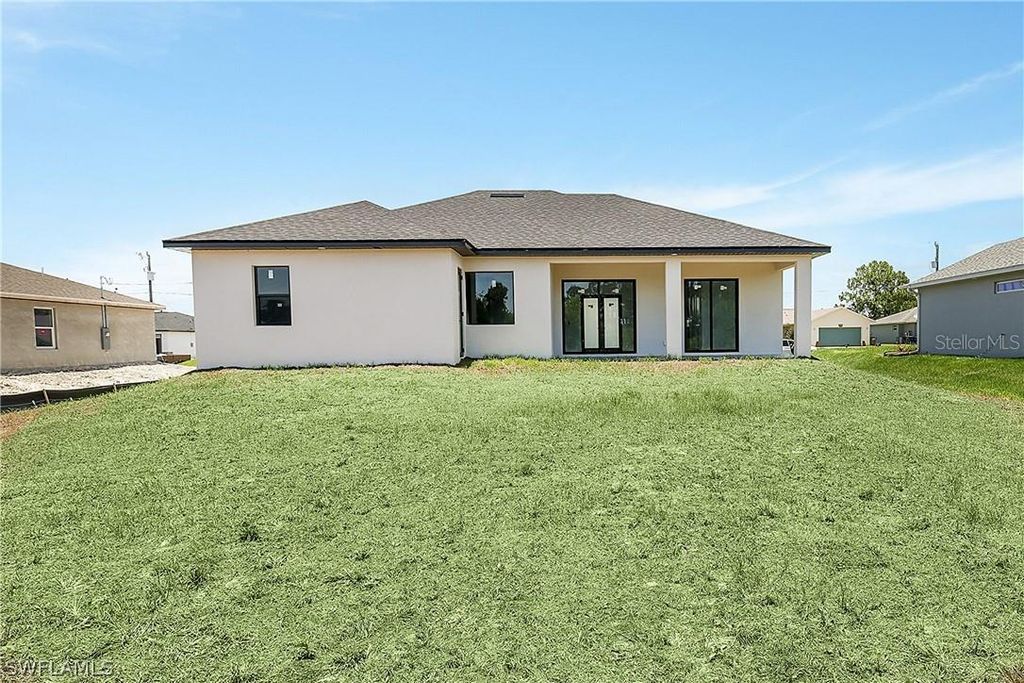 Photo of 2921 7th Street SW, Lehigh Acres, FL 33976 (MLS # S5123956)