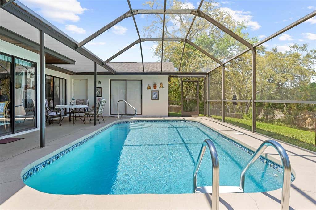 Photo of 4488 Bluewater Avenue, Spring Hill, FL 34606 (MLS # W7884884)