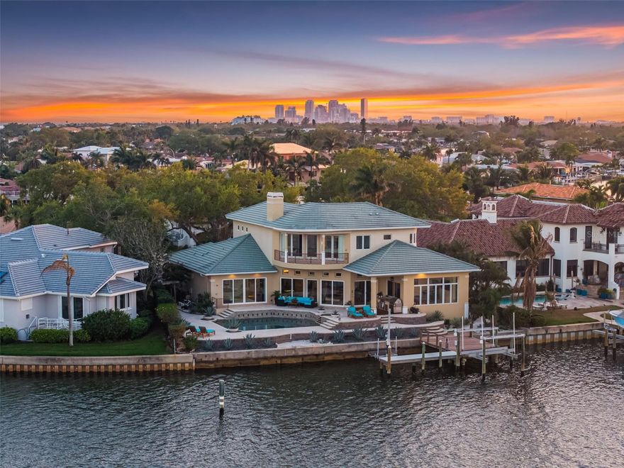Welcome home to one of the most extraordinarily rare open waterfront opportunities in St. Petersburg. Imagine waking each morning to endless open water, the first light of sunrise glistening across Tampa Bay as dolphins quietly pass your dock and the distant skyline shimmers on the horizon. Tucked at the end of a quiet cul-de-sac on the coveted open-water side of Mermaid Point, this exceptional custom estate offers something rarely seen in today’s market. Homes on this stretch of open waterfront almost never come available, making this a true generational opportunity to own one of the most spectacular vantage points in the area. From nearly every major living space, sweeping views stretch across Tampa Bay toward the protected beauty of Weedon Island Preserve and the distant skyline of Downtown Tampa. Custom built by award-winning builder Tom Pici & Son, the home blends durability with refined modern living. Constructed with block and steel, impact-rated windows and doors, and elevated above the base flood elevation, the residence has never flooded, reflecting its thoughtful positioning and quality construction. Set along 107' of deep sailboat water, the property is ideal for boating enthusiasts. The Speeler-built dock with two boat lifts allows you to be cruising the open waters of Tampa Bay in minutes. Inside, Brazilian hardwood double doors open to a tranquil foyer highlighted by a dramatic floor-to-ceiling indoor waterfall. The homes open design and soaring 12' ceilings flood the interior with natural light while framing expansive water views. A Crestron integrated smart home system provides effortless control of lighting, climate, entertainment, and security, while motorized window treatments, recessed LED lighting, whole-house water filtration, and two Rinnai tankless water heaters enhance comfort and efficiency. The chefs kitchen is designed for gathering and entertaining, featuring custom cabinetry by Michael Bright and a Newer premium appliance suite including a Wolf gas range, Sub-Zero refrigeration, and Miele coffee station with Miele double ovens. A stunning Madagascar granite island with prep sink anchors the space, while a hidden walk-in pantry and built-in breakfast banquette connect seamlessly to the family room, where a wood-burning fireplace and breathtaking water views create a warm gathering place. The expansive primary suite serves as a private retreat overlooking the bay and skyline, complete with its own fireplace and a spa-inspired bath featuring a Pearl whirlpool tub, steam shower, floating double vanity, warming rack, Toto smart toilet and bidet, and spacious custom dressing room. Additional living spaces include a screening room with seating for eight, 3 additional en-suite bedrooms—including a wellness room and a junior suite with direct pool access—and 2 interior laundry rooms. Outdoor living is equally exceptional. A two-tier waterfront deck overlooks the open bay, while the Sekas-designed saltwater pool and spa with swim jets, sun shelf, LED lighting, and outdoor kitchen creates the perfect setting for entertaining or quiet evenings under the stars. While the setting feels private and serene, the location is remarkably convenient—just minutes from Downtown St. Petersburg, the Vinoy Golf Club, world-class dining, museums, waterfront parks, and the vibrant St. Pete Pier. 2279 Mermaid Point offers a rare opportunity to live on one of the most extraordinary open-water settings in all of St. Petersburg.