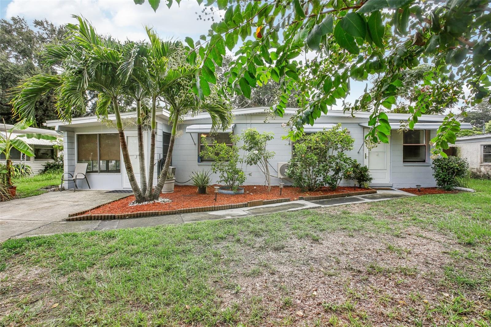 Fantastic location! No Flood Zone! Unincorporated Largo This 2 bedroom 1 bath home has a LOT to offer. NEW ROOF (2023) NEW WATER HEATER and NEW LUXURY VINYL FLOORING. 2 NEWER Mini-Spit AC units. You will be impressed by the large backyard with ample storage and the privacy that the NEW VINYL FENCE offers. If that wasn't enough you will also be able to pick your own tropical fruit from a variety of mature fruit trees or just relax in the shade in the large screened in Florida room. If you are looking for a great starter home or just looking to downsize, or a home away from home this is for you. Close to everything a person could ask for! Easily commute to Tampa or St Petersburg from this very convenient location. Tampa International Airport is 17 miles away for avid travelers, while our Gulf of Mexico beaches are a short 6 mile drive! This home is in a NON FLOOD ZONE, NO HOA, NO CDD!