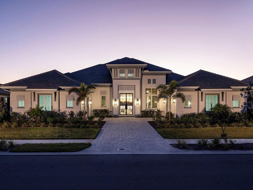 Welcome to Wild Blue at Waterside, where luxury coastal living meets natural beauty. Stock Luxury Homes presents an exquisite blend of timeless architecture, semi-custom details, and expansive open spaces. This stunning WYNDAM IV MODEL HOME features 4 bedrooms, 4.5 bathrooms, a spacious Great Room, elegant Dining Room, a dedicated Study, and 4 car garage.   Enjoy seamless indoor-outdoor living with a dynamic outdoor space complete with a pool, spa, outdoor kitchen and fireplace. This MODEL HOME is being sold with leaseback terms through December of this year. This Quick Close Sales Price includes the furniture and decor package!