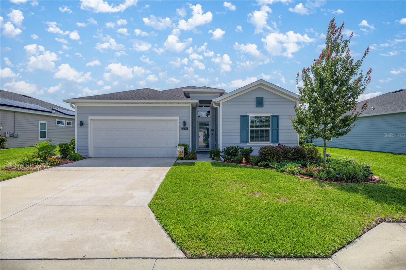 Experience Community living in this quiet 55 & older community of Liberty Village with NO BACK NEIGHBORS! This 2023, 2039 SQ FT Trevi model home has 3 bedrooms/3 bath Plus an office! One bedroom is an ensuite! (see floor plan) Triple sliders lead to your Screened lanai overlooking 9 ACRES where new walking trails are being constructed .Tall 9’4” ceilings throughout. Large gourmet kitchen with quartz countertops, walkin pantry & island that overlook your livingroom/dining room. The master suite has 2 walkin closets and a large walkin shower. Ceramic tile is found throughout & carpet in the bedrooms. New gutters and a whole home water filtration system have been installed. Bring the pets w/ your SLEEK black aluminum fenced yard, full landscaping & bird houses! HOA covers high speed internet, TV, Pool, Pickleball, Bocci Ball & Shuffleboard courts. Golf Cart friendly! Sellers are being called back up North!