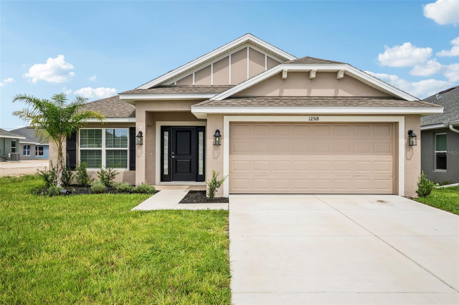 One or more photo(s) has been virtually staged. Two master suites – in this Almost brand-new home! This beautifully built in 2024, this
4-bedroom, 3-bathroom, 2-car garage home is only 1 year old, and it is truly move in ready. It’s an open floor plan, country style home with a welcoming entrance way and beautiful vinyl fenced in back yard. When you walk in the front door you will immediately feel at home. Beautiful matching neutral color counter tops, and wood cabinets in the kitchen and bathrooms. Complete black and stainless kitchen appliance package including the matching refrigerator. Tile in the kitchen, in all three bathrooms, and in the spacious inside laundry room. The master suite was upgraded with a trey ceiling, it’s spacious with room for a king-sized bed, the walk-in closet is huge, the master bath has dual vanities, water closet, linen closet and a tiled walk-in shower. This home is open and offers a true split bedroom floor plan. Bedrooms 2 and 3 share an exceptionally large, semiprivate Jack and Jill style bathroom. The 2nd master suite (in-law suite) is bedroom 4. Its spacious, has a large closet and its own private bathroom. Energy efficient A/C unit, dual pane windows throughout, and LED lighting all help keep the electric bill down. There are many items included in this home, that are not included in a new build including – the vinyl fenced in yard, fully screened in lanai, blinds built into the lanai door, ceiling fans, window coverings, expanded/ additional zones for the sprinkler system, Wi-Fi enabled garage door opener. The Pine Bluff subdivision is a new home community, perfectly located towards the center of Spring Hill. There are NO CCD fees, and a very low HOA fee – to help maintain standards and property values in the community. This home is currently vacant and is truly 100% move in ready. Call for your private tour today, and if you have any questions – Just ask. (All measurements are approximate)