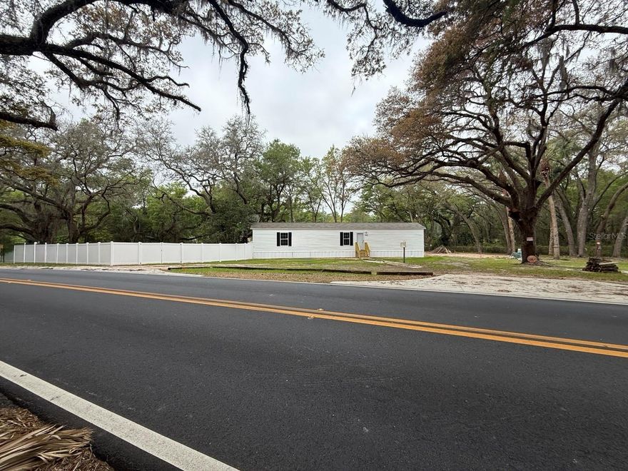 Brand new 3 bedroom 2 bathroom manufactured home on over half an acre in a peaceful Ocklawaha setting. Zoned A1, this unique property offers the rare opportunity to have two homes on one parcel making it ideal for investors, rental income, or multigenerational living. The seller has already completed major groundwork for a second homesite including installation of the electric meter box, a prepared pad, and a second septic permit that is already approved, which is a valuable benefit since septic approvals can take significant time to obtain. Some additional permits and impact fees have also been partially paid giving the future owner a strong head start. An added bonus is the seller has a connection to purchase a second manufactured home at a discounted price below typical retail or showroom pricing creating an excellent opportunity for buyers looking to add a second residence affordably. The home is brand new, never lived in, and move in ready, and the seller is currently in the process of having a fence installed for added privacy and functionality. Outdoor enthusiasts will appreciate the close proximity to Moss Bluff Boat Ramp and Dam offering access to the scenic Ocklawaha River where boaters can travel toward Silver Springs or head in the opposite direction toward the Harris Chain of Lakes making this a prime location for boating, fishing, and exploring Florida’s natural waterways. The property is also near Lake Bryant and the Ocala National Forest known for extensive trails, horseback riding, hiking, and outdoor recreation. A rare opportunity to own a flexible property that works as a primary residence, family compound, or income producing investment in a quiet rural area. BUYERS MAY ALSO BE ELIGIBLE TO RECEIVE UP TO A 1% LENDER CREDIT UPON SUCCESSFUL CLOSING WHEN USING THE SELLER’S PREFERRED LENDER.